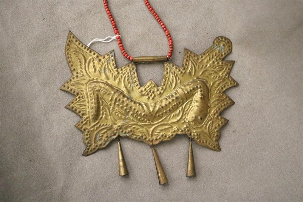 INDONESIAN PALEMBANG NAGA KALUNG NECKLACE. Brass pendant or breastplate, often referred to as a: INDONESIAN PALEMBANG NAGA KALUNG NECKLACE. Brass pendant or breastplate, often referred to as a Kalung (necklace) or Ageman (attire/ornament) in a broader sense, specifically a Pendant or Liontin (pe