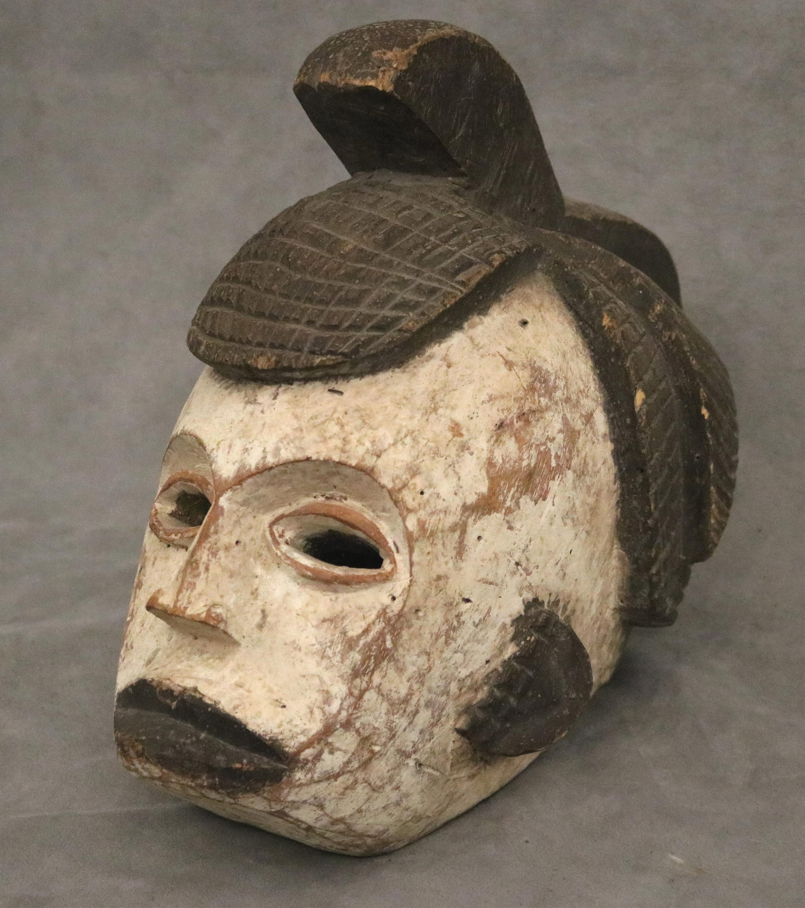 Nigerian Igbo People Agbogho Mmanwu Wooden Mask - height: 13 inches.: Nigerian Igbo People Agbogho Mmanwu Wooden Mask This carved wooden mask (seen in IMG_2100.jpg) is a traditional artifact from the Igbo people of southeastern Nigeria, specifically representing the Agb