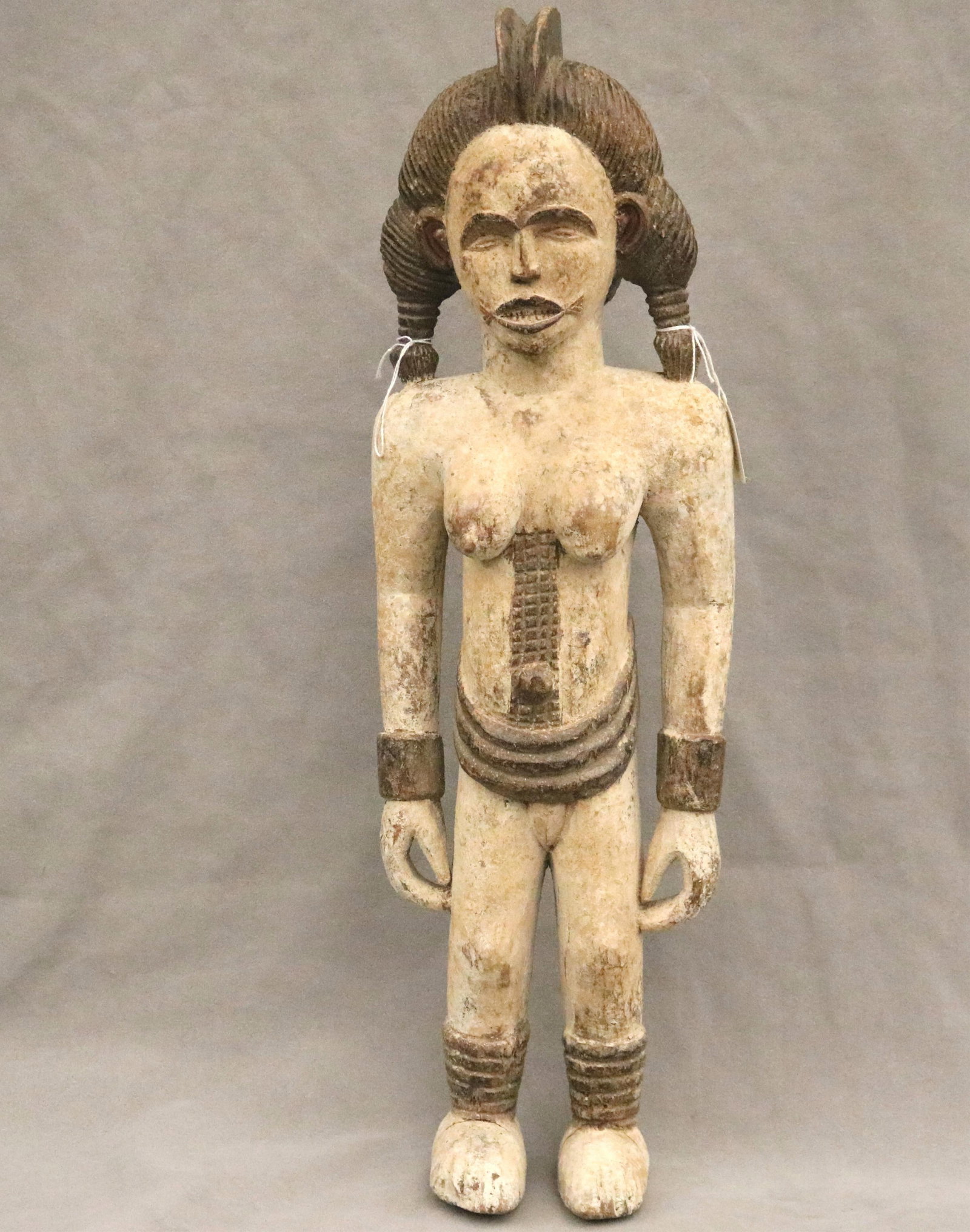 NIGERIAN IGBO ALUSI SHRINE FIGURE - Height: 24 inches.: NIGERIAN IGBO ALUSI SHRINE FIGURE This Igbo Alusi shrine figure from Nigeria is a powerful sculptural representation of a tutelary deity or spirit, serving as an intermediary between the human communi