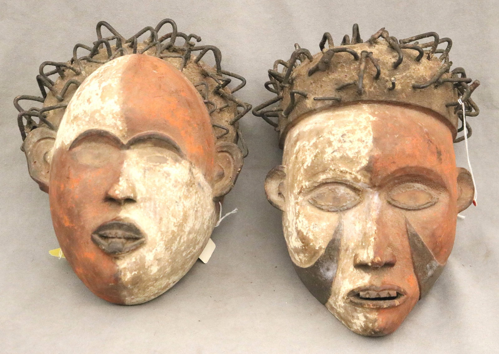 CONGOLESE BAKONGO SPIRITUAL PROTECTION MASKS - height: (approx.) 11.5 inches.: CONGOLESE BAKONGO SPIRITUAL PROTECTION MASKS This pair of Bakongo masks from the Democratic Republic of the Congo presents a striking example of ritual sculpture designed for spiritual mediation and c