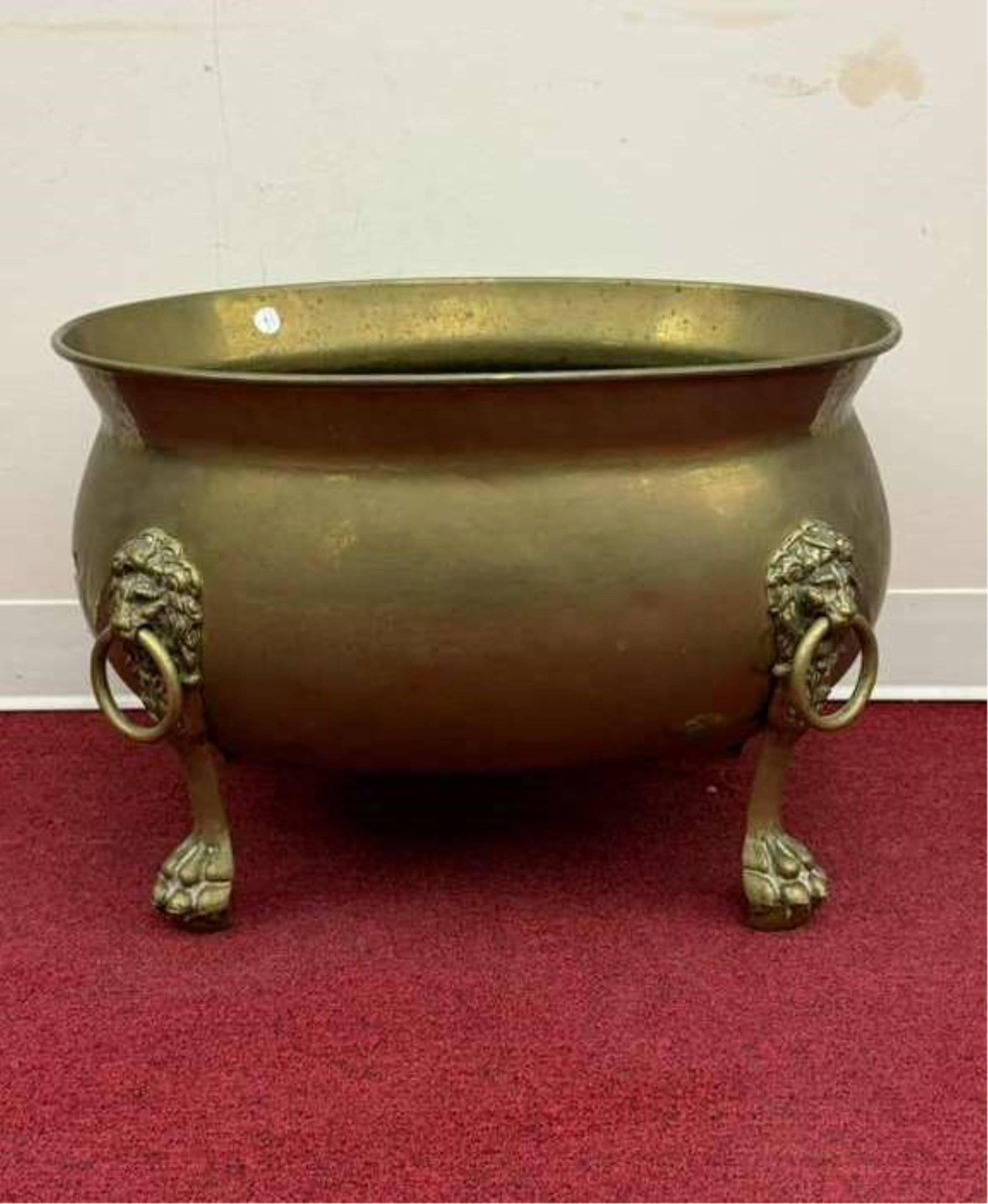 EARLY 20TH CENTURY ENGLISH NEOCLASSICAL BRASS OVAL FOOTED WINE COOLER - H: 16". Top, 23 1/2 x 18: EARLY 20TH CENTURY ENGLISH NEOCLASSICAL BRASS OVAL FOOTED WINE COOLER Lion mask-and-ring handles; ball-and-claw feet. H: 16". Top, 23 1/2 x 18 3/4".