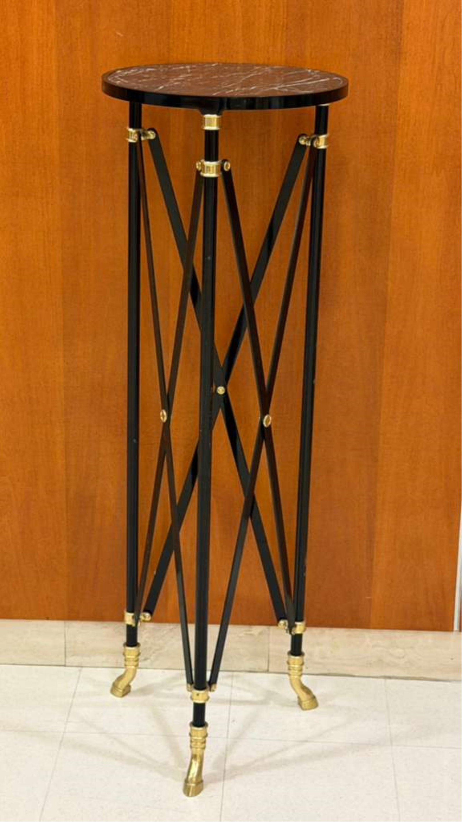 GUERIDON WITH MARBLE TOP BLACK AND GILT IN THE STYLE OF AN ANCIENT ROMAN FOLDING TABLE - H: 47 1/2".: GUERIDON WITH MARBLE TOP BLACK AND GILT IN THE STYLE OF AN ANCIENT ROMAN FOLDING TABLE H: 47 1/2". TOP, D: 16".