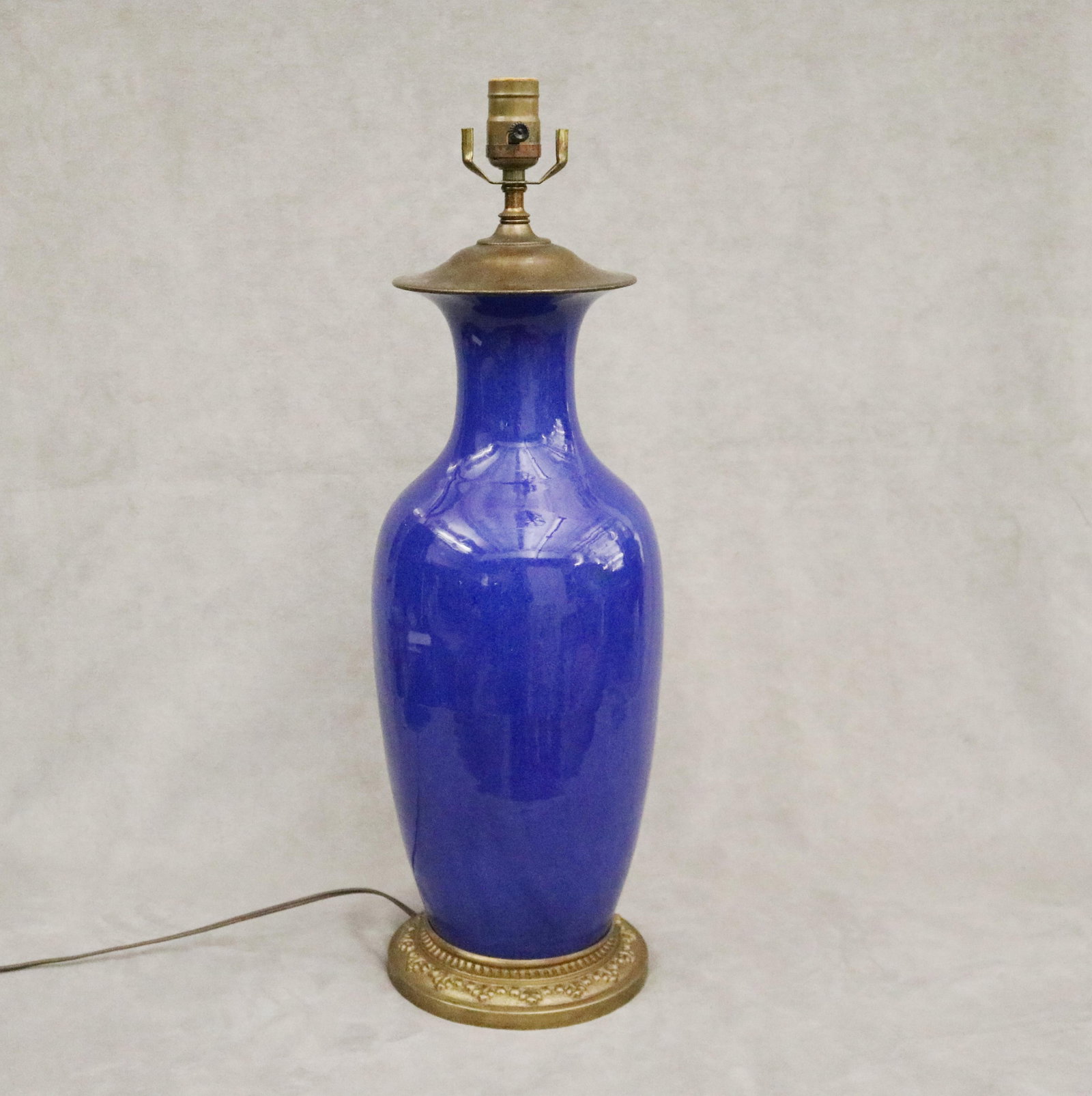COBALT BLUE MOTTLED GLAZED BALUSTER-FORM PORCELAIN VASE MOUNTED AS TABLE LAMP: Relief-molded gilt circular base. Vase, H: 17 1/2 in.