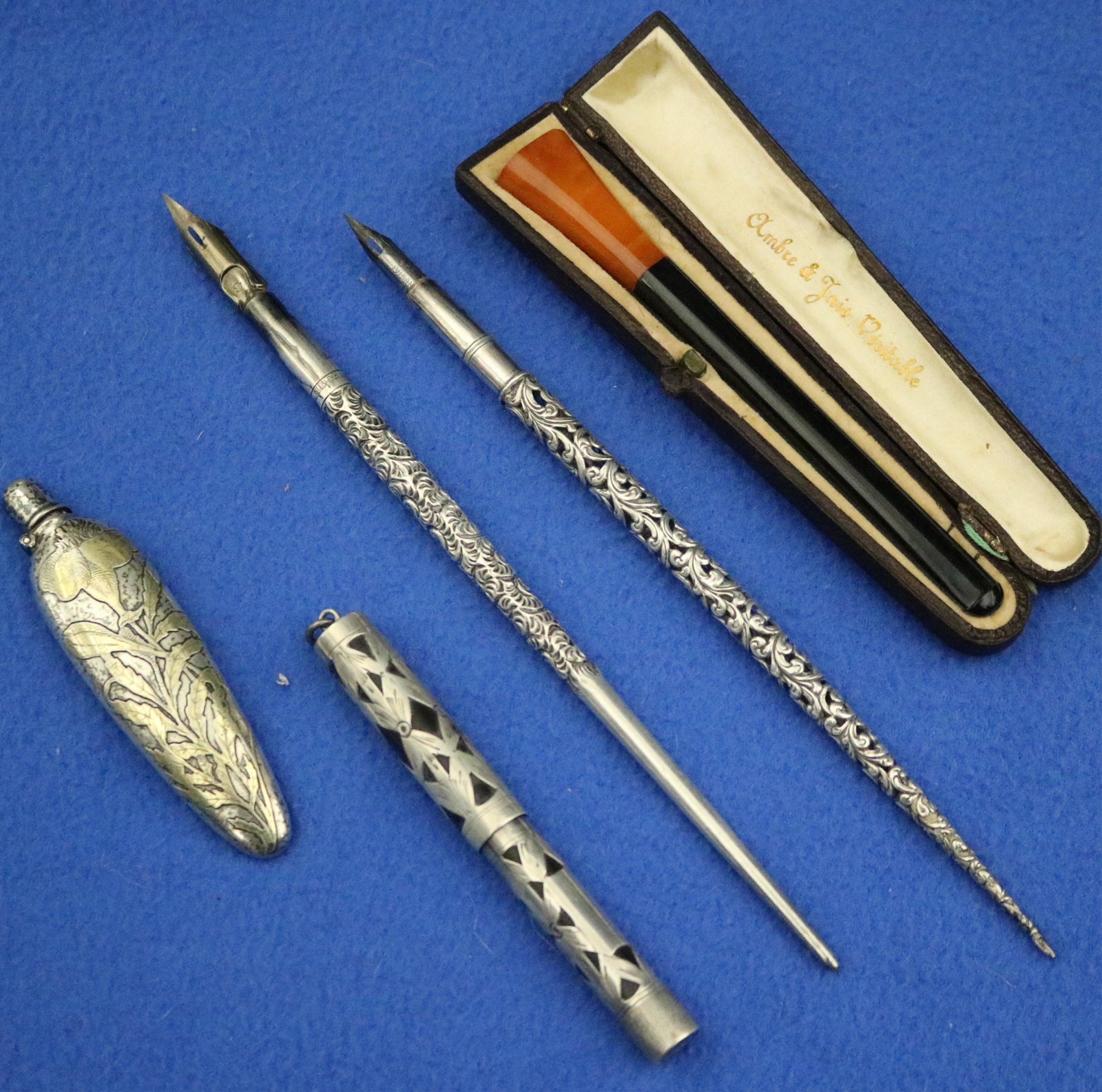 THREE STERLING SILVER PENS AND A PERFUME FLASK, AND A VINTAGE CIGARETTE HOLDER, early 20th century - (1 of 20)