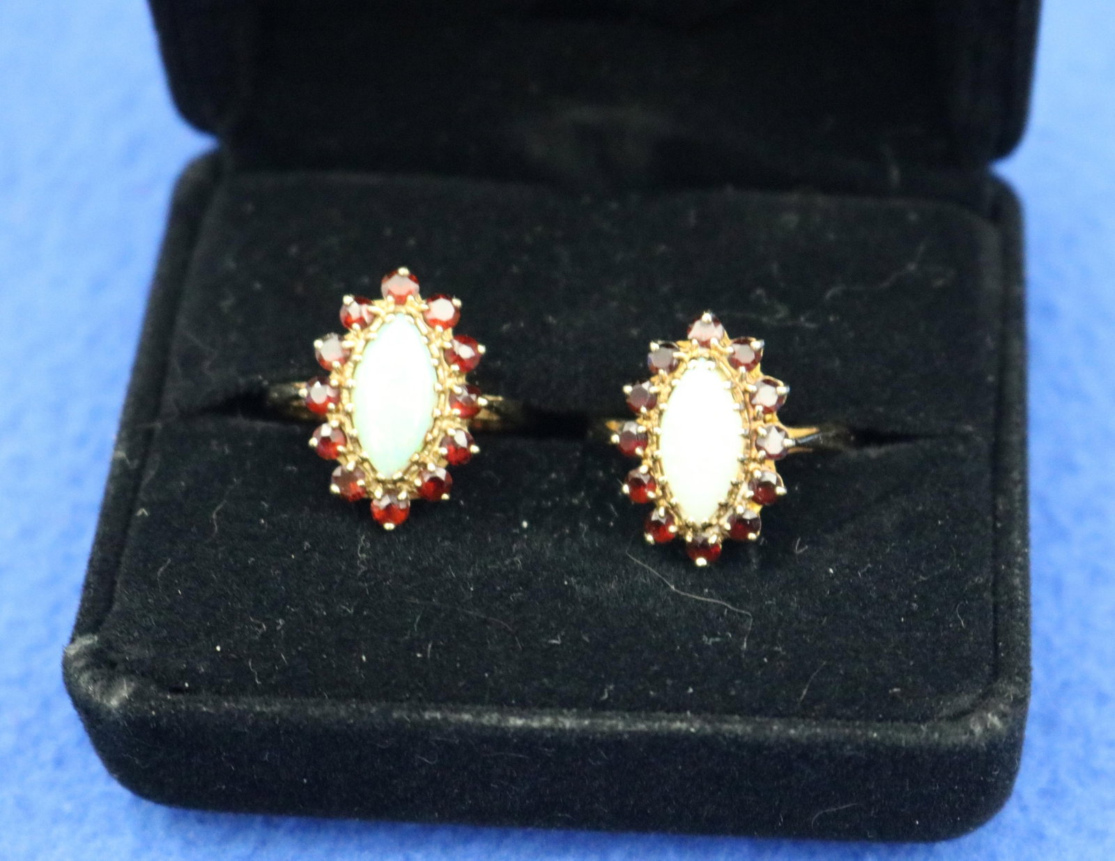 PAIR 10K YELLOW GOLD PRECIOUS WHITE OPAL AND GARNET NAVETTE-SHAPE RINGS - Ring size: 8. Gross wt. 4 (1 of 11)