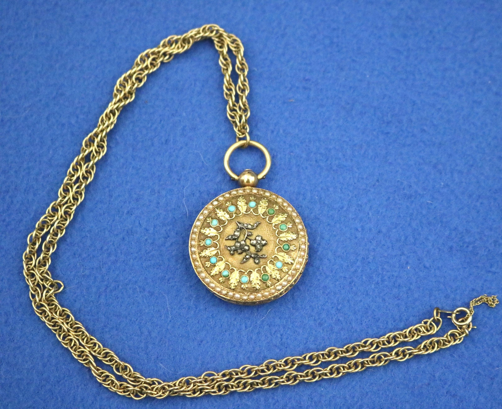 LADY'S CONTINENTAL YELOW GOLD, ROSE CUT DIAMOND, TURQUOISE AND SEED PEARL PENDANT WATCH 19th century: LADY'S CONTINENTAL YELOW GOLD, ROSE CUT DIAMOND, TURQUOISE AND SEED PEARL PENDANT WATCH 19th century Reverse of case has flowering branch motif set with rose cut diamonds centering by floral wreath