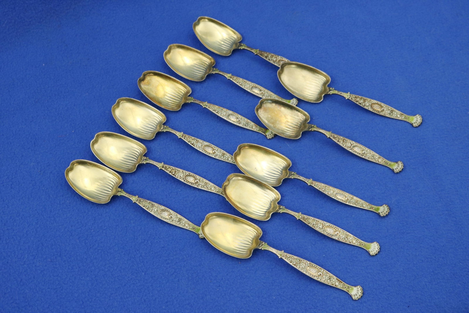 SET ELEVEN WHITING CO. STERLING SILVER ICE CREAM SPOONS late 19th century - Wt. 6.4 troy oz..: SET ELEVEN WHITING CO. STERLING SILVER ICE CREAM SPOONS late 19th century Enameled handles; vermeil bowls Wt. 6.4 troy oz.