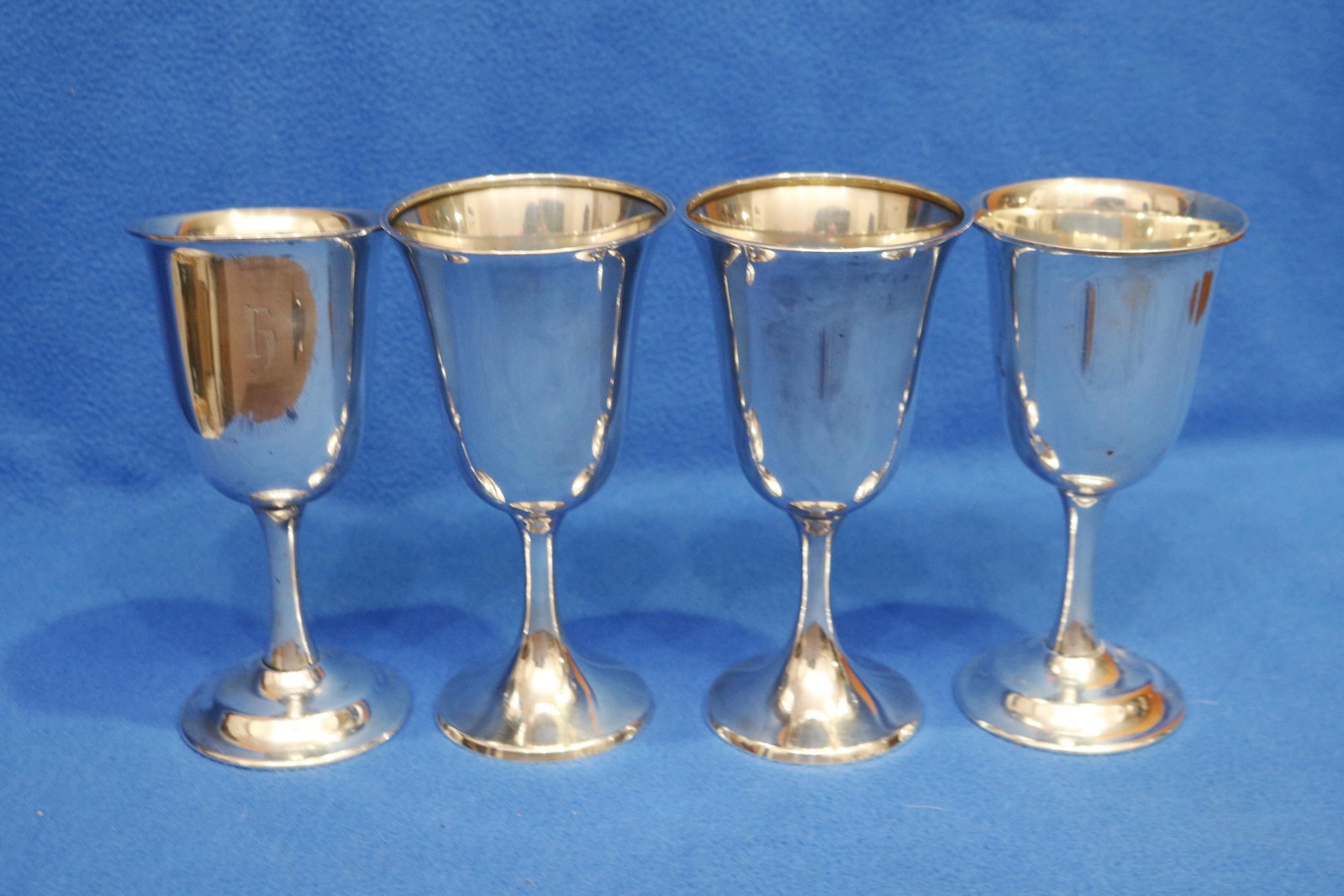NINE CLOSELY SIMILAR STERLING SILVER WINE GOBLETS - H: 6 7/8 in. Wt. 32 troy oz.. (1 of 6)