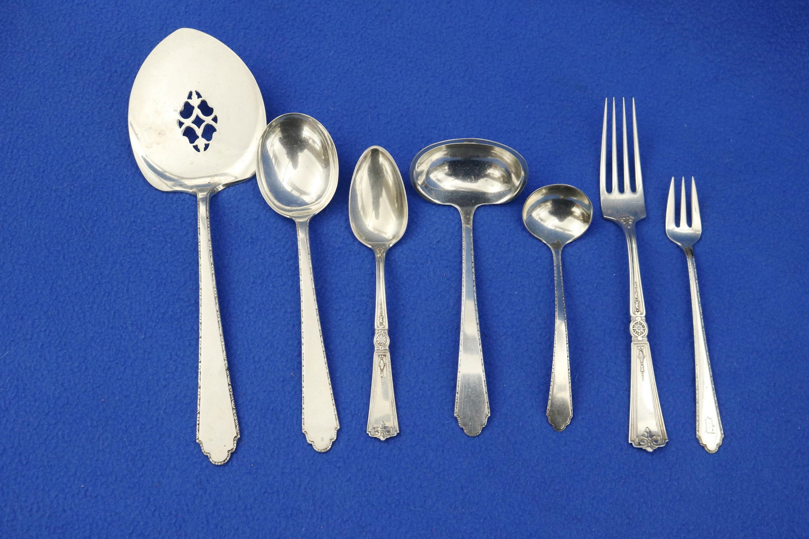 TWO PARTIAL SETS STERLING SILVER FLATWARE - Wt . 32 troy oz..: TWO PARTIAL SETS STERLING SILVER FLATWARE 32 pieces including 14 pieces Lunt Co. "William & Mary" pattern (10 oyster forks, chowder spoon, gravy ladle, cream ladle, and flat server); and 18 pieces Dur