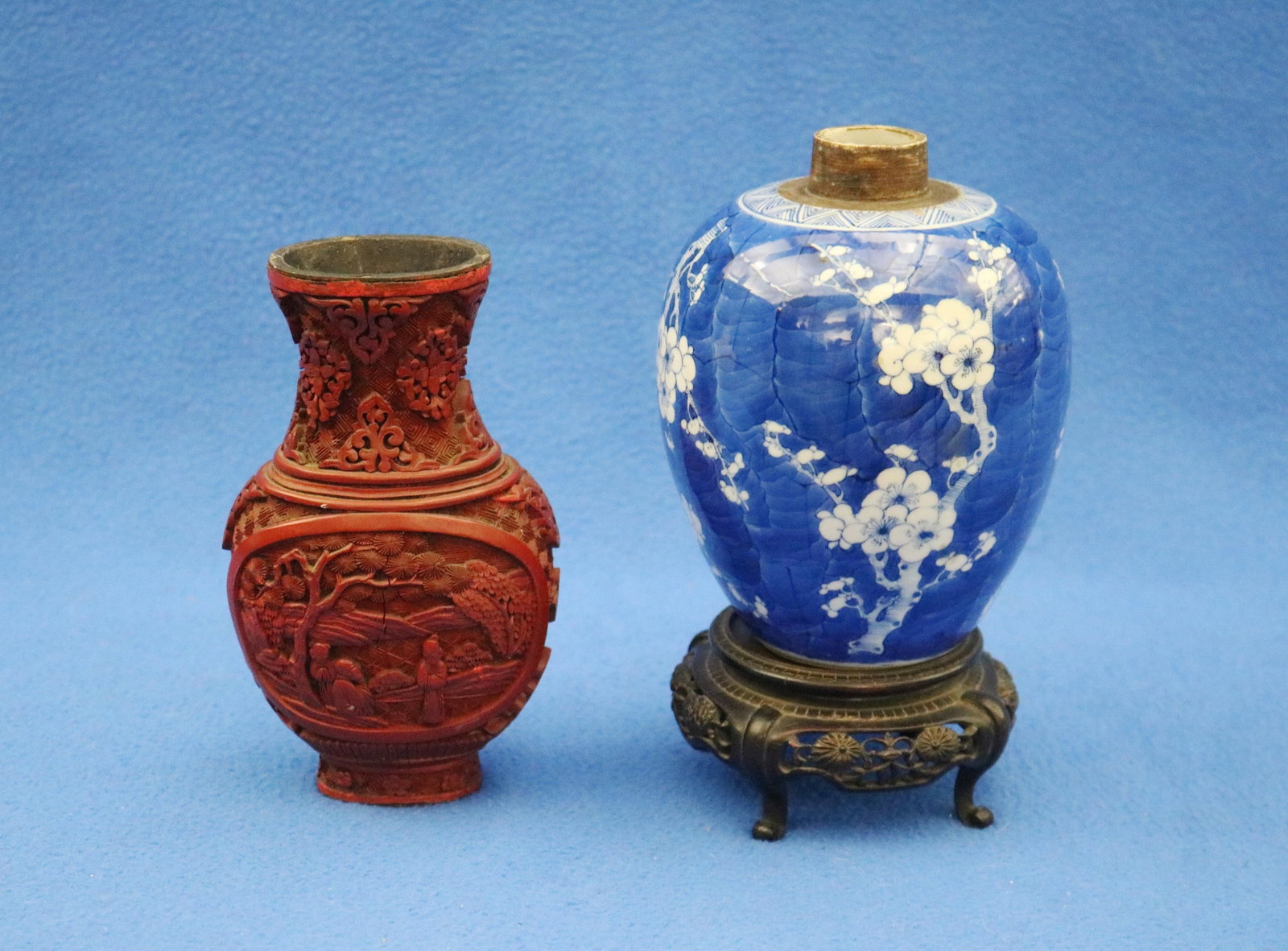 TWO CHINESE VASES early 20th century - .: TWO CHINESE VASES early 20th century One, blue and white porcelain ovoid, with carved teakwood cover and separate stand. Other, carved cinnabar, with decoration of figures in landscape, H; 6 in.