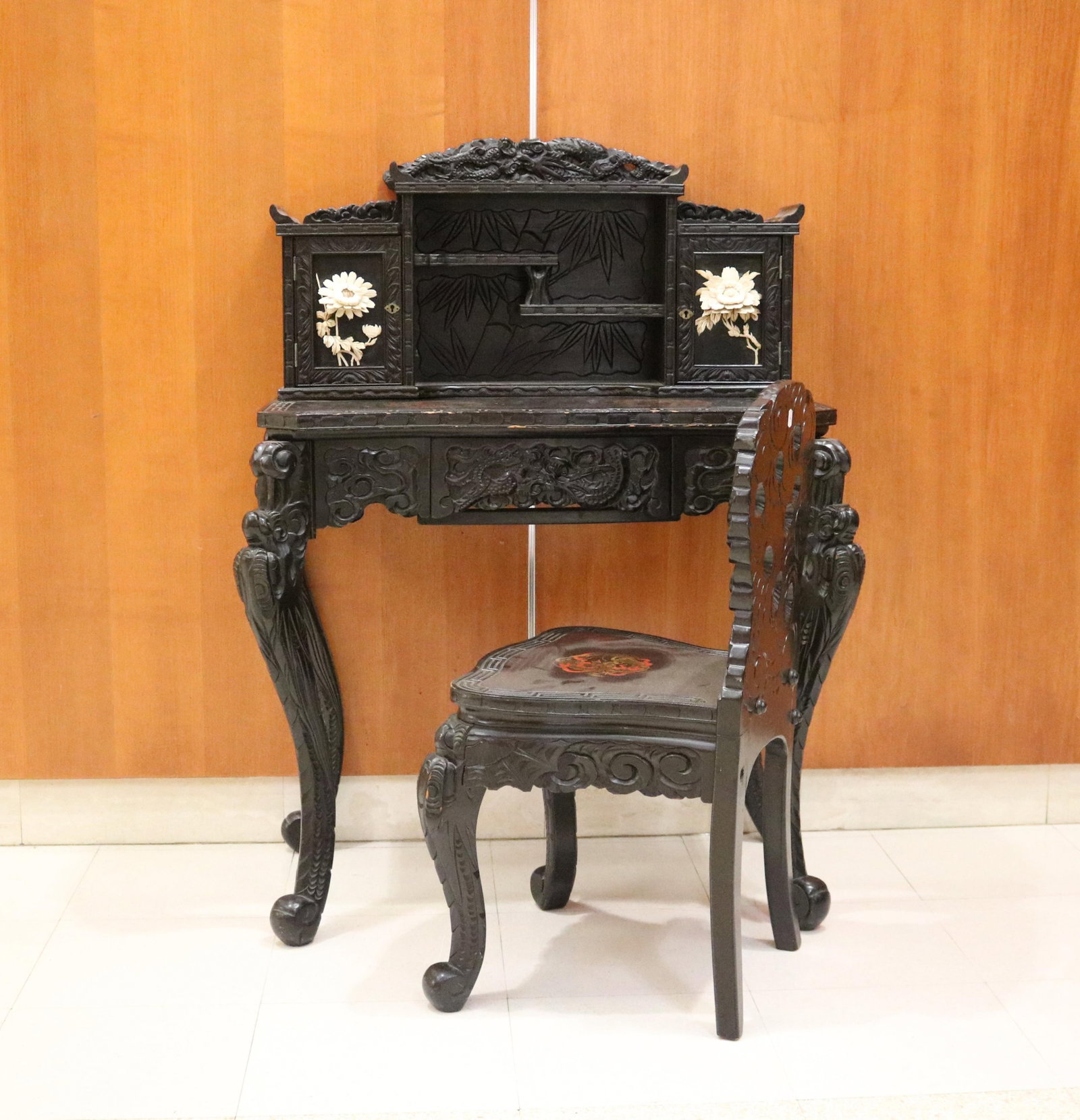CHINESE CARVED AND PAINTED WRITING DESK WITH MATCHING DESK CHAIR - Desk, H: 42 3/4 in.; W: 30 in.: CHINESE CARVED AND PAINTED WRITING DESK WITH MATCHING DESK CHAIR Desk has superstructure with compartment having staggered shelves centered by pair cabinet doors with applied, high-relief bone flowerh