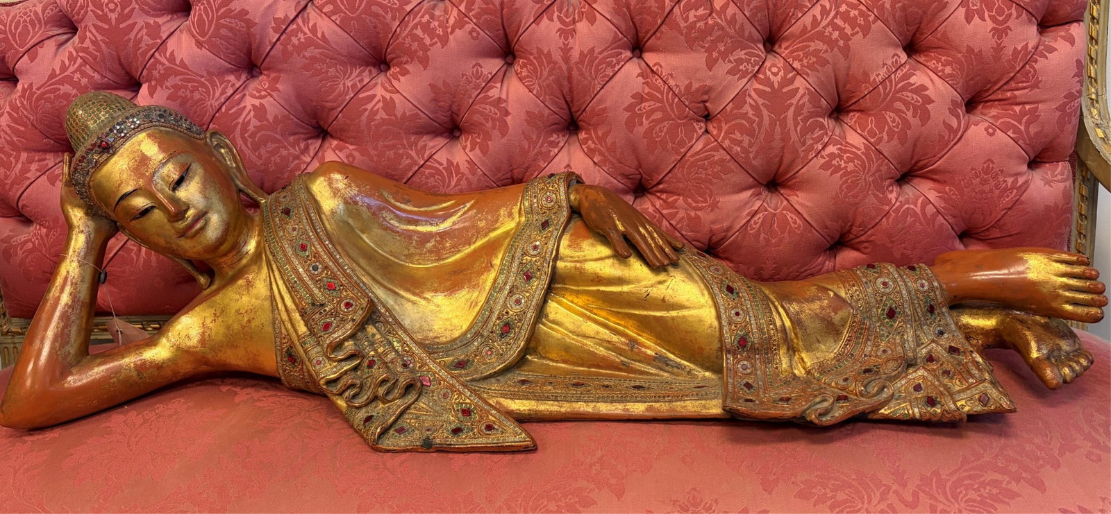 LARGE GILDED AND GEM-INLAID RECLINING BUDDHA (PARINIRVANA), BURMESE, MANDALAY STYLE early 19th: LARGE GILDED AND GEM-INLAID RECLINING BUDDHA (PARINIRVANA), BURMESE, MANDALAY STYLE early 19th Century Reclining Buddha depicted intraditional pose on his right side with his head resting on his