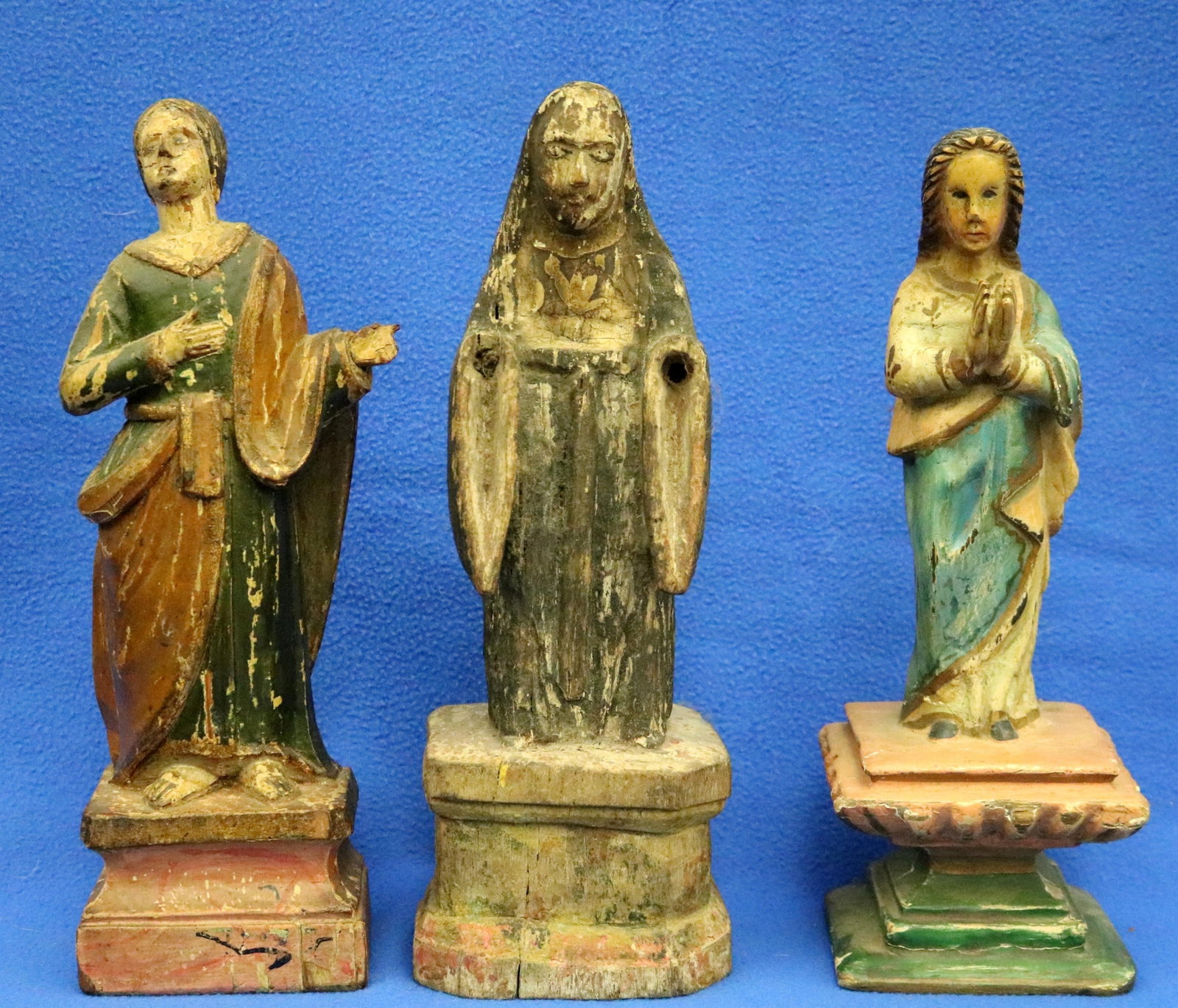 THREE CARVED DECORATED WOODEN SANTO FIGURINES - Height (approx): 12 inches. (1 of 20)