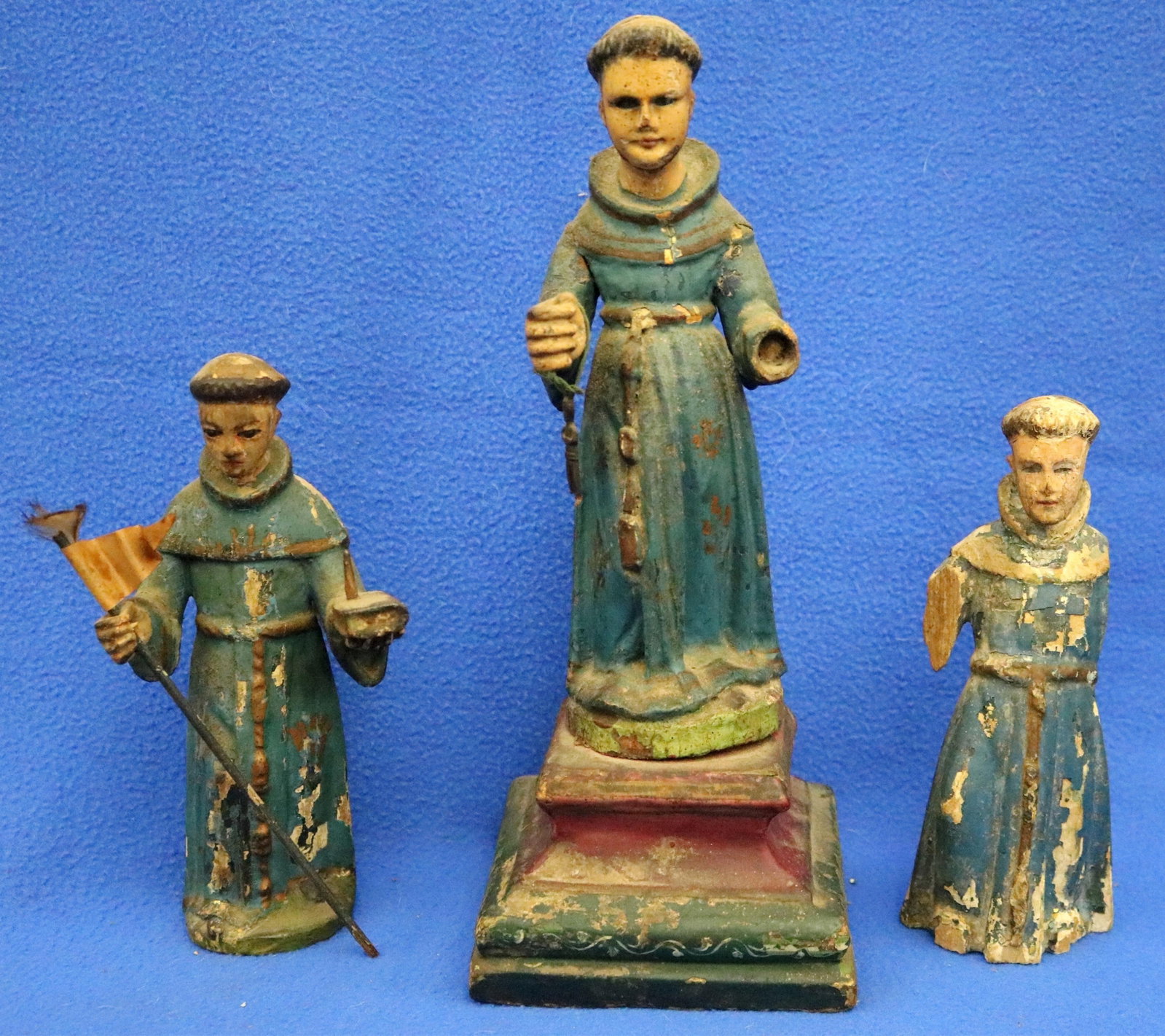 THREE WOODEN SANTO FIGURINES EACH DEPICTING FRANCISCAN FRIARS. - height central figure (including (1 of 17)