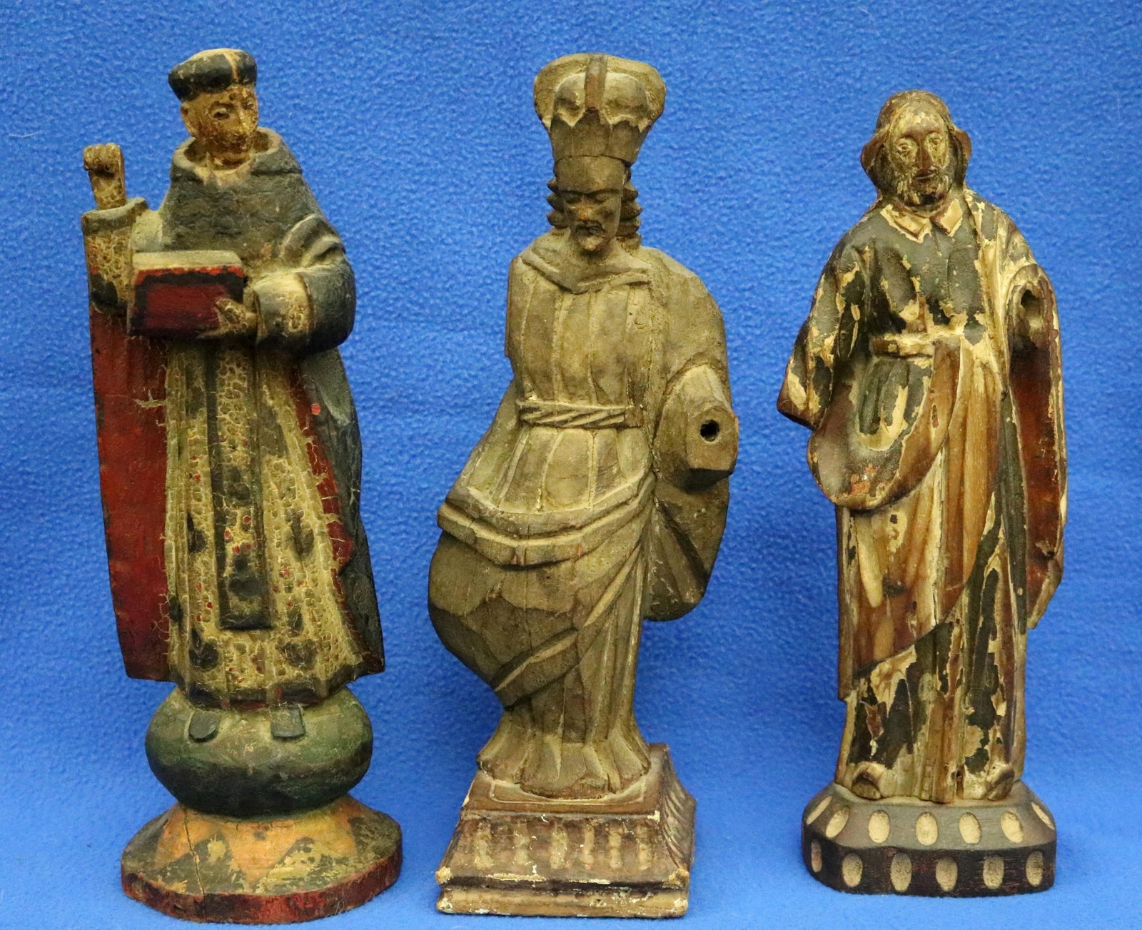 THREE PATINATED WOODEN SANTO FIGURINES OF A MONK AND TWO SAINTS - Height (approx.) 11 inches. (1 of 17)
