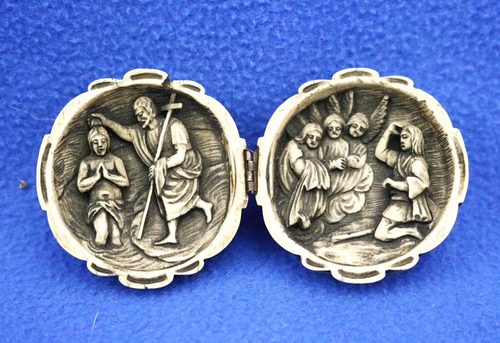 PRAYER NUT FEATURING THE BAPTISM OF CHRIST AND A CELESTIAL SCENE - Diameter is 2 inches.: PRAYER NUT FEATURING THE BAPTISM OF CHRIST AND A CELESTIAL SCENE Undated. Northern European prayer nut ? a small spherical capsule that opens on a hinge to reveal two carved scenes inside. The outside