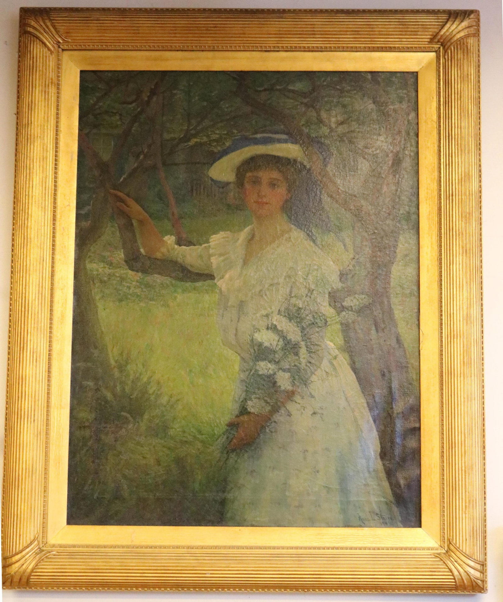 ANNA LEE STACEY (American, 1865-1943). The White Dress, 1903, Oil on canvas, 40 x 29.5 inches;: ANNA LEE STACEY American, 1865-1943 The White Dress, 1903 Oil on canvas Signed and dated lower right. Imposing painting of a young woman standing amid the dappled light and leafy branches of a sun-dre