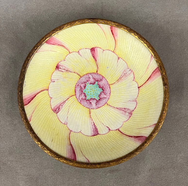 SIGNED NICHOLAS HAYDON, NYC, GILT-METAL MOUNTED PAINTED PORCELAIN PLATE. Rose, turquoise and yellow: SIGNED NICHOLAS HAYDON, NYC, GILT-METAL MOUNTED PAINTED PORCELAIN PLATE. Rose, turquoise and yellow large flowerhead decoration; raised on four cast feet. D: 6 1/4".