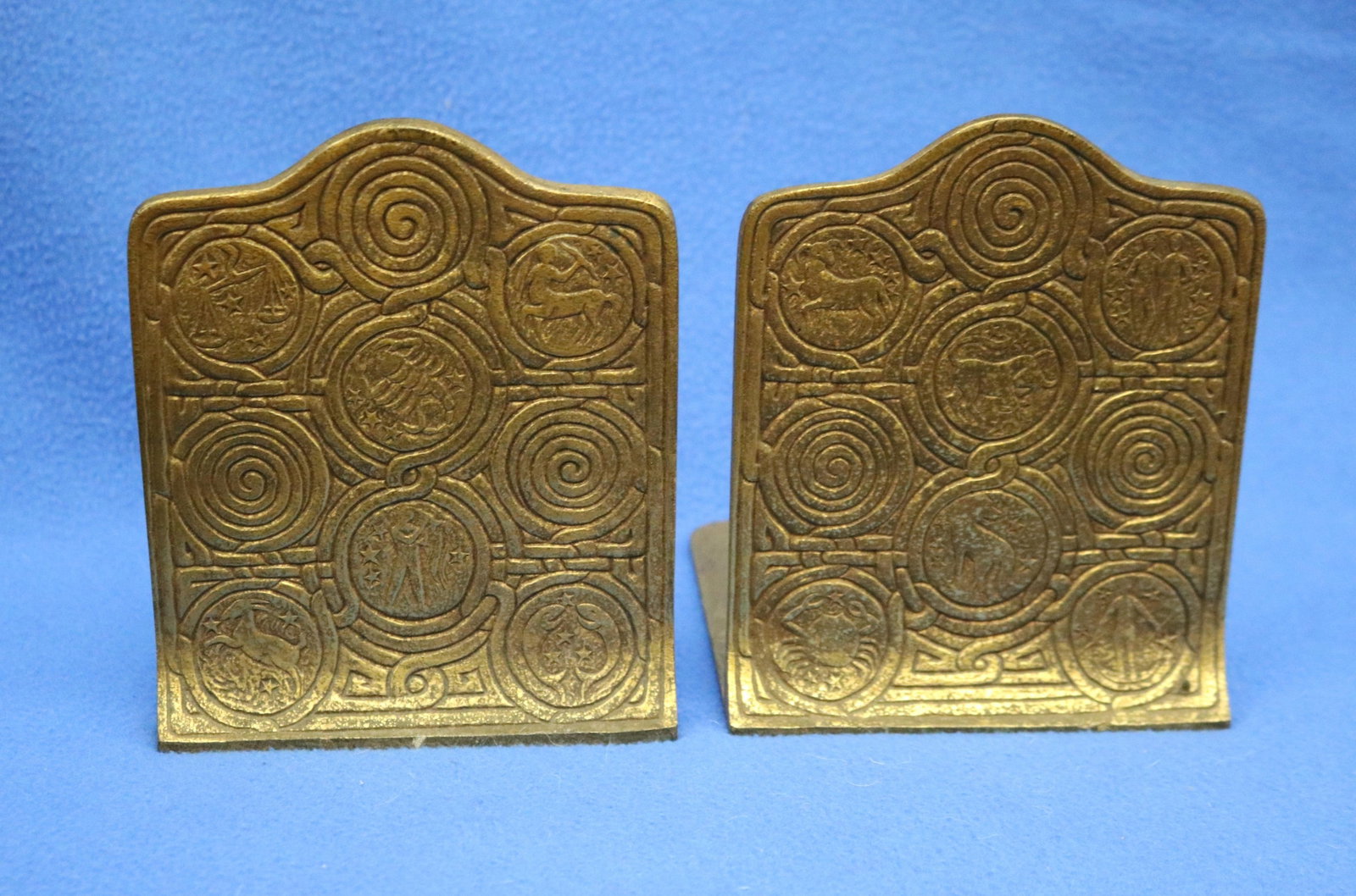 PAIR SIGNED TIFFANY STUDIOS, NEW YORK, GILT BRONZE BOOKENDS FROM "ZODIAC" - H: 6 in.. (1 of 6)
