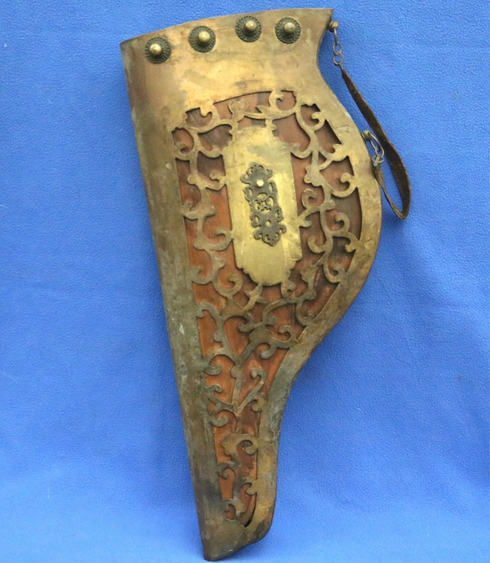 OTTOMAN OR CENTRAL ASIAN INSPIRED BRASS-OVERLAID ARROW QUIVER - 24 in. x 101/2 in..: OTTOMAN OR CENTRAL ASIAN INSPIRED BRASS-OVERLAID ARROW QUIVER Curved, asymmetrical silhouette; intricate pierced-work (ajoure) brass overlay in scrolling foliate set against a contrasting dark leather