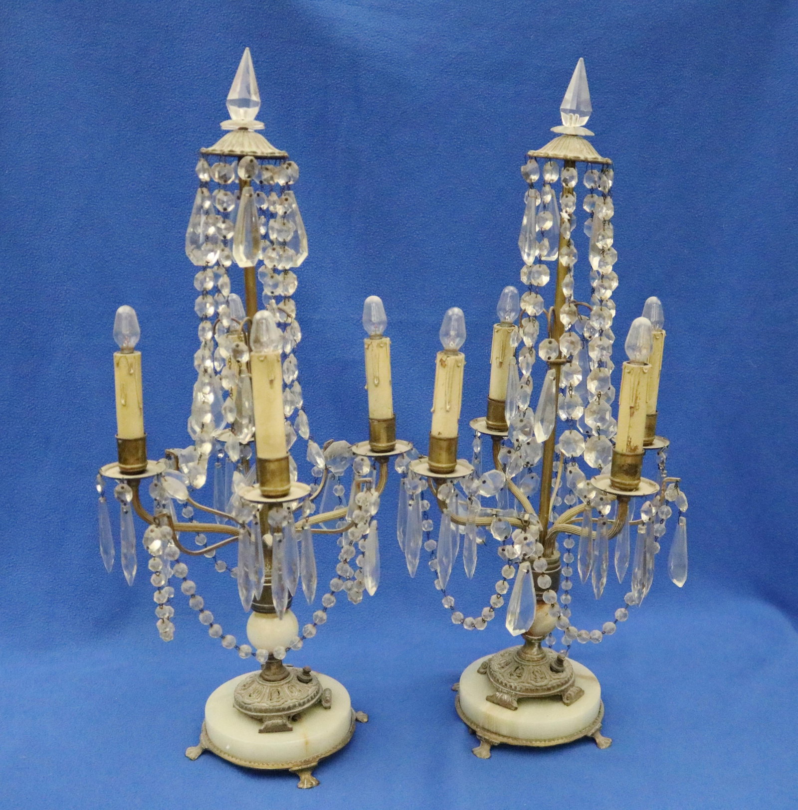 PAIR FOUR LIGHT BRASS CANDELABRA STRUNG WITH CRYSTAL BEAD SWAGS AND SUSPENDING LUSTERS - H: 25. (1 of 7)
