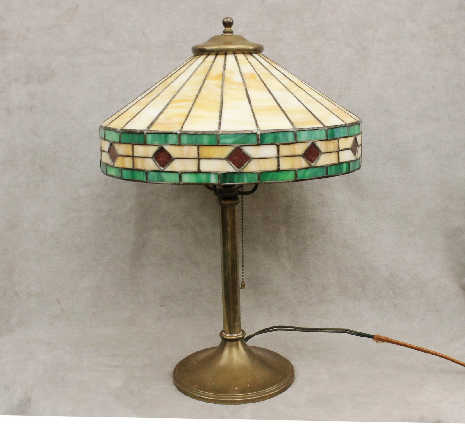 ART NOUVEAU LEADED GLASS TABLE LAMP WITH GEOMETRIC SHADE WITH CREAM-COLORED, GREEN, AND RED GLASS (1 of 15)