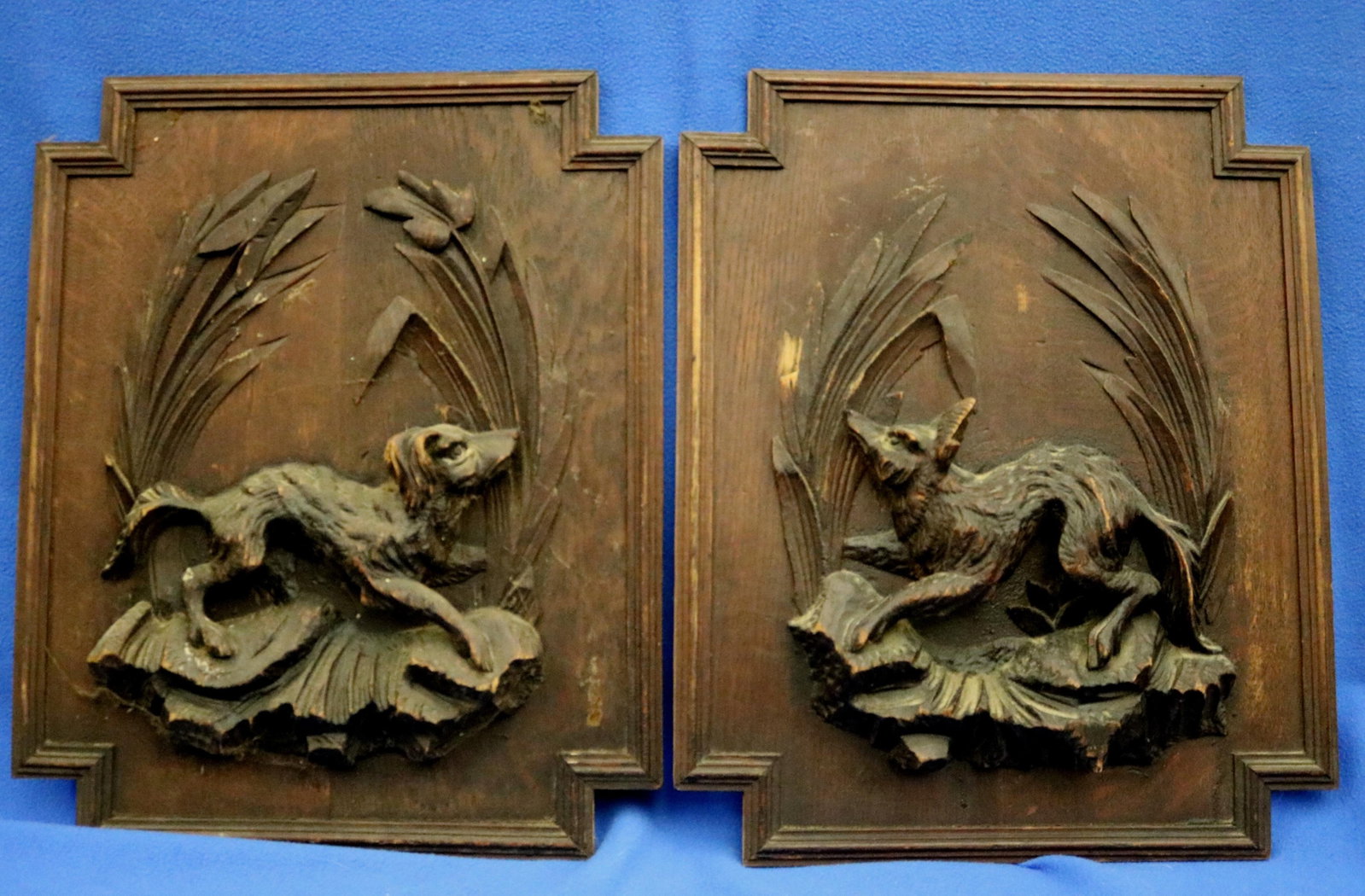 PAIR CONTINENTAL HAND-CARVED HIGH-RELIEF WOODEN BLACK FOREST STYLE HUNT PLAQUES - Each panel: 19 in.: PAIR CONTINENTAL HAND-CARVED HIGH-RELIEF WOODEN BLACK FOREST STYLE HUNT PLAQUES Originally used as decorative doors for large pieces of furniture such as a buffet de chasse. Each panel: 19 in. x 15