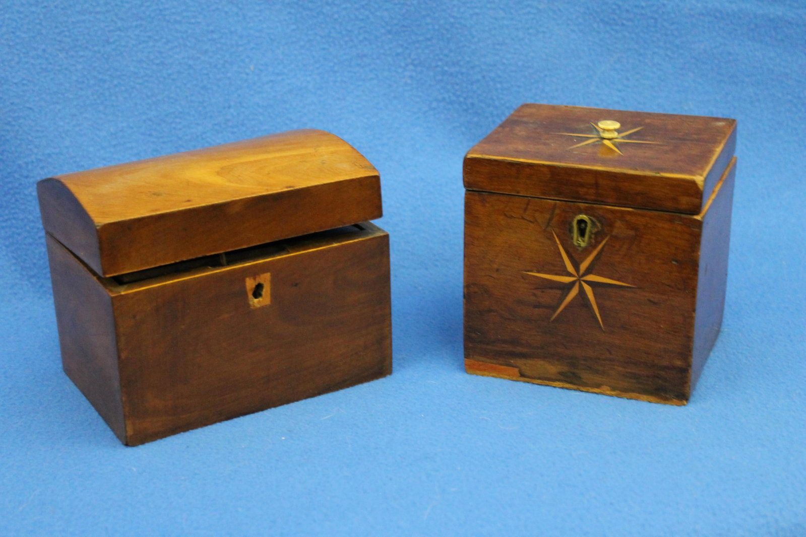 TWO EARLY 19TH CENTURY INLAID HINGE-TOP TEA CADDIES early 19th century - Larger, top, 5 in. x 3 3/4: TWO EARLY 19TH CENTURY INLAID HINGE-TOP TEA CADDIES early 19th century One, with domed top; other, inlaid with compass star. (Imperfections). Larger, top, 5 in. x 3 3/4 in.