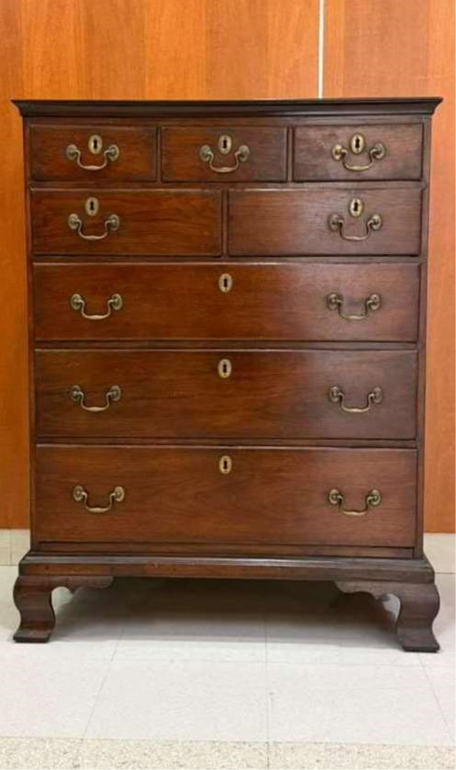 AMERICAN CHIPPENDALE CHERRYWOOD EIGHT-DRAWER CHEST - H: 43 1/4 in. Top, W: 33 in. D: 17 3/4 in..: AMERICAN CHIPPENDALE CHERRYWOOD EIGHT-DRAWER CHEST Banded top projects over cove-molded apron above three aligned short drawers over two half-width drawers above three graduated full-width drawers; og