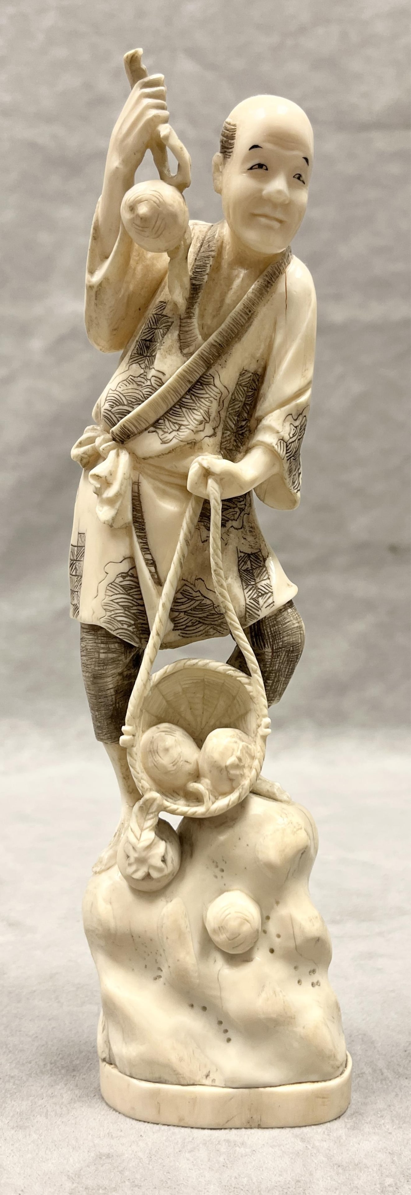 CHINESE CARVING OF MAN STANDING AND HOLDING FRUIT - H; 9 1/2 in.. (1 of 7)