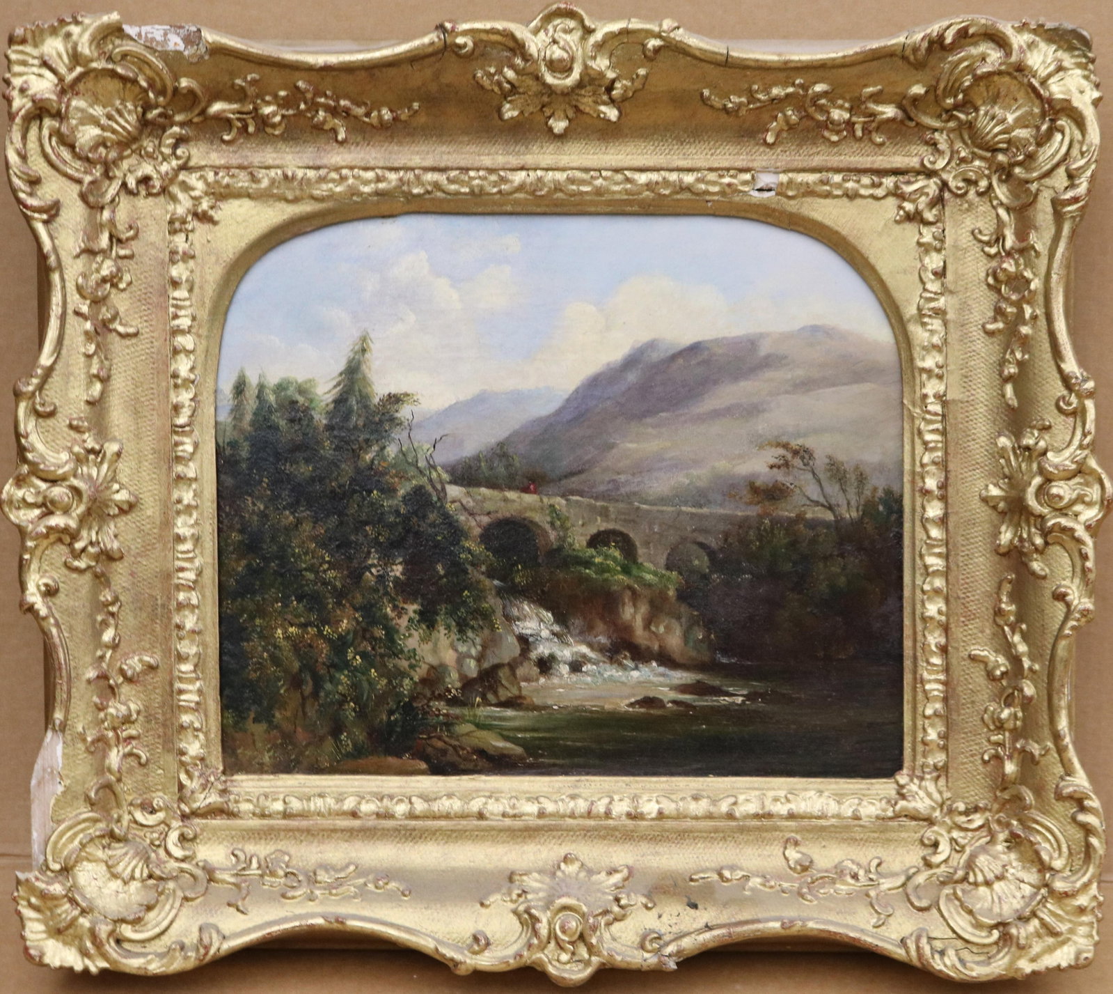 EDWARD TRAIN (ATTRIBUTED) (Scottish, 1801 - 1866). Bridge Near Cougie, Scotland, Oil on canvas, 39 x: EDWARD TRAIN (ATTRIBUTED) Scottish, 1801 - 1866 Bridge Near Cougie, Scotland Oil on canvas oil on canvas painting that depicts a rustic stone arched bridge spanning a Highland river, framed by dense w