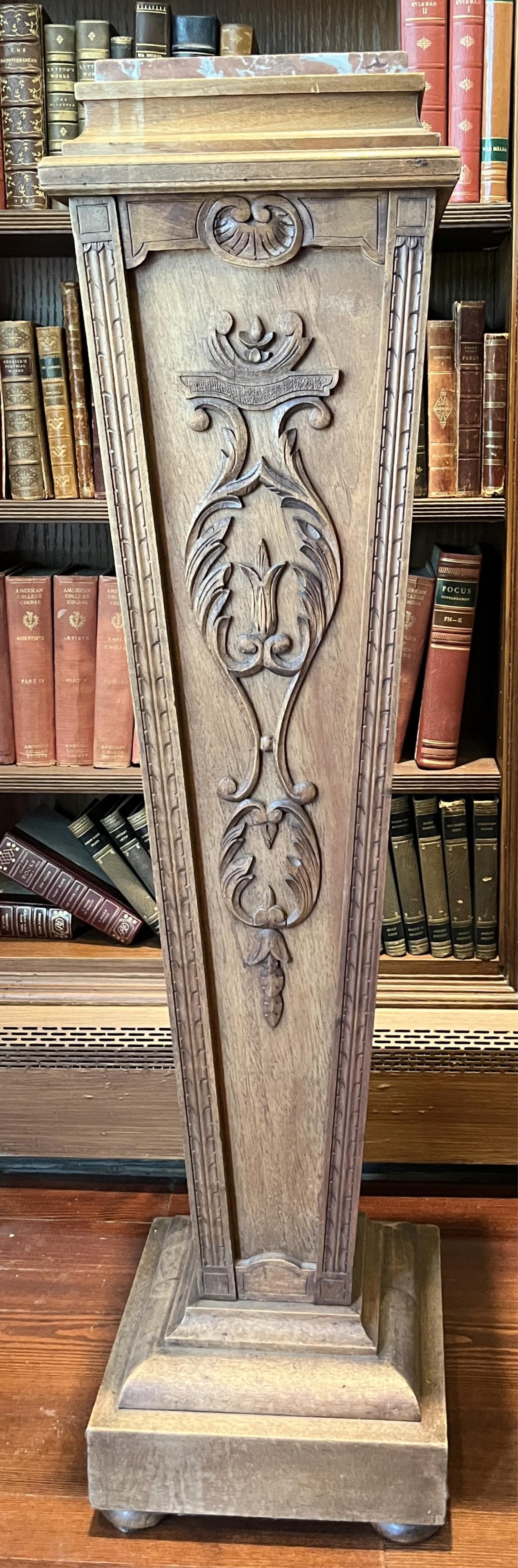 LOUIS XVI STYLE CARVED WALNUT SQUARED, TAPERING PEDESTAL WITH LANGUEDOC MARBLE SQUARE TOP - H: 44: LOUIS XVI STYLE CARVED WALNUT SQUARED, TAPERING PEDESTAL WITH LANGUEDOC MARBLE SQUARE TOP H: 44 1/2 IN; W: 11 IN; D: 11 IN PROVENANCE: ?Merry Hill?, an historic mansion built in 1899 and located in Gr