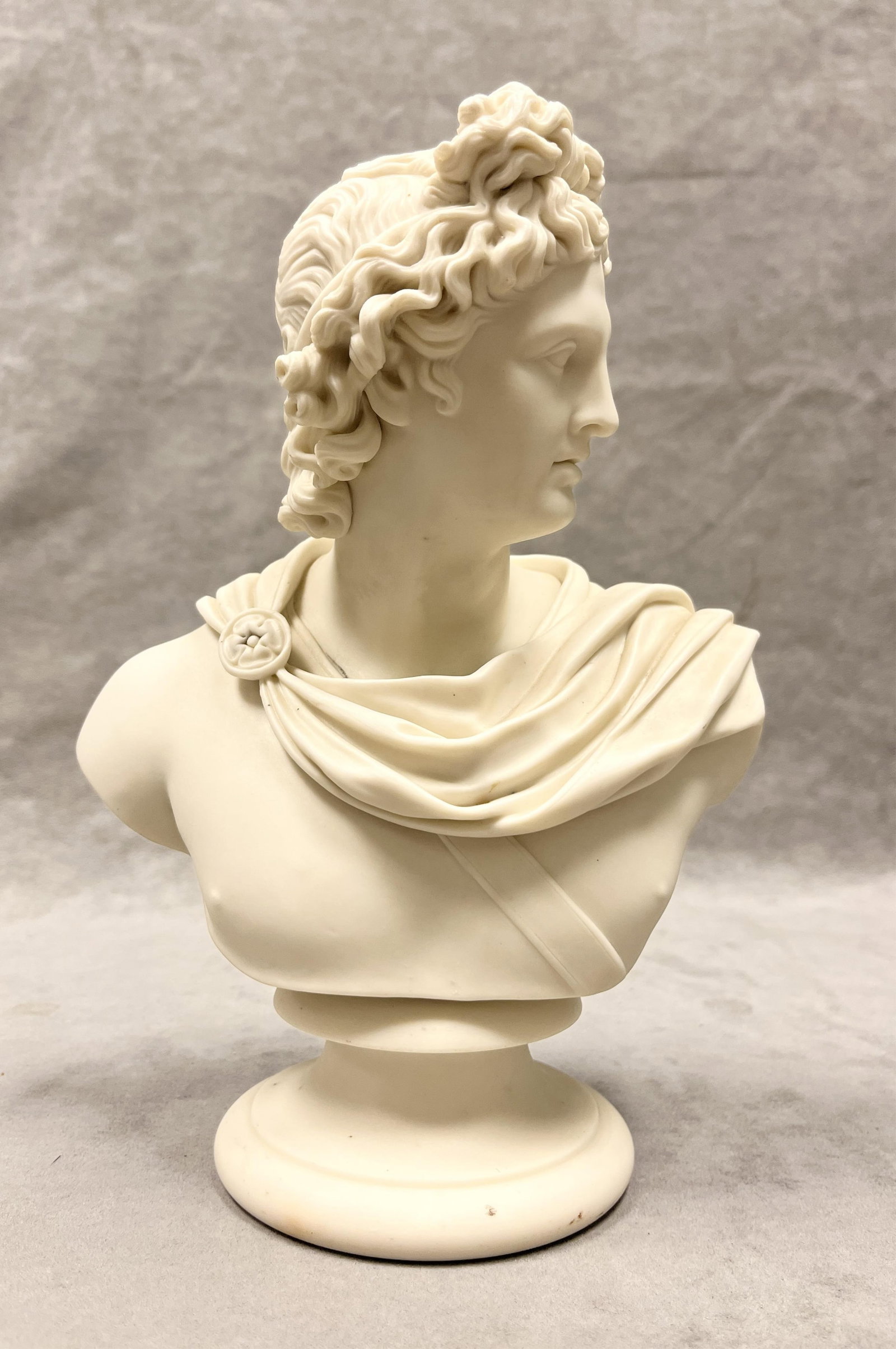 BISQUE PORCELAIN BUST MODELED AS APOLLO BELVEDERE After the original by sculptor C. Delpech for the: BISQUE PORCELAIN BUST MODELED AS APOLLO BELVEDERE After the original by sculptor C. Delpech for the Art Union of London H: 10 3/8 inches