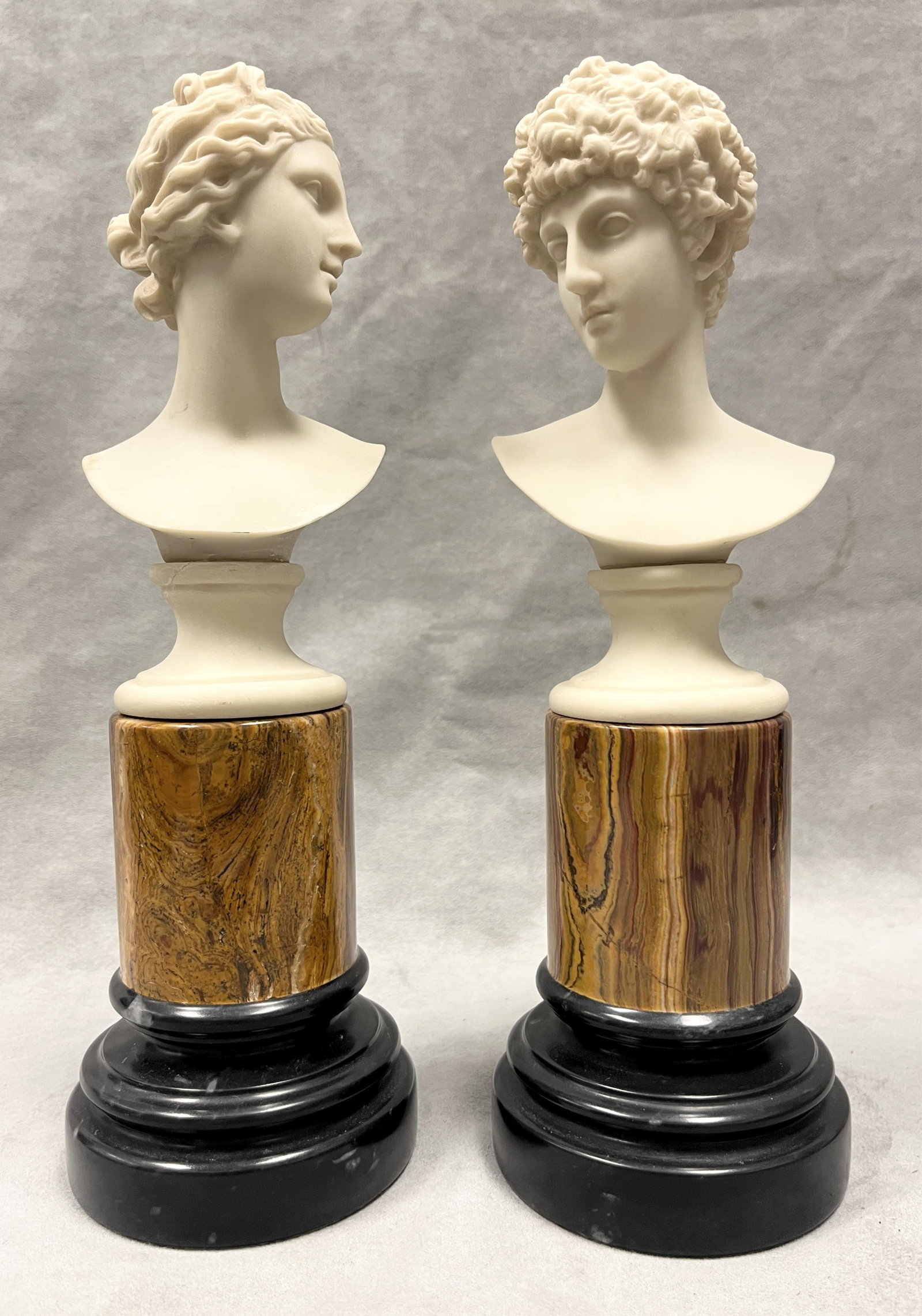 COMPOSITION MARBLE NEOCLASSICAL STYLE BUSTS OF ARTEMIS AND APOLLO ON MARBLEIZED CYLINDRICAL BASES - (1 of 6)