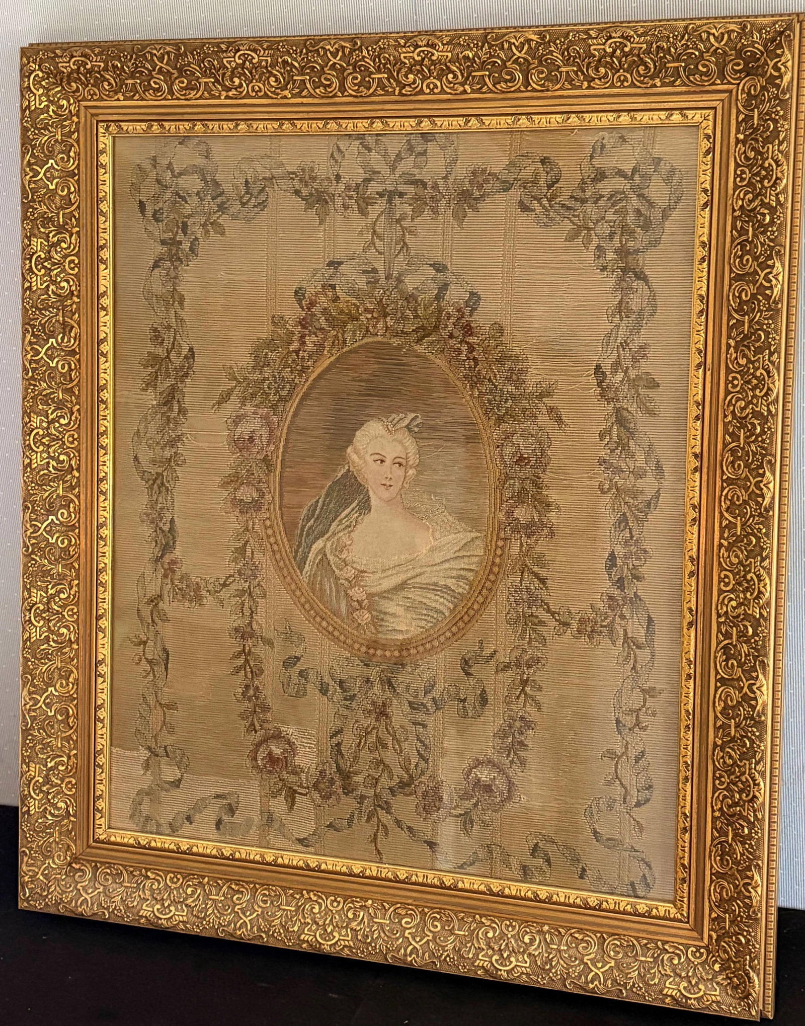 NEEDLEWORK PANEL DEPICTING PORTRAIT MEDLALLION OF A NOBLE LADY - 23 x 19 inches; frame: 29 x 25: NEEDLEWORK PANEL DEPICTING PORTRAIT MEDLALLION OF A NOBLE LADY Oval medallion framed by a beaded border. Framed. 23 x 19 inches; frame: 29 x 25 inches