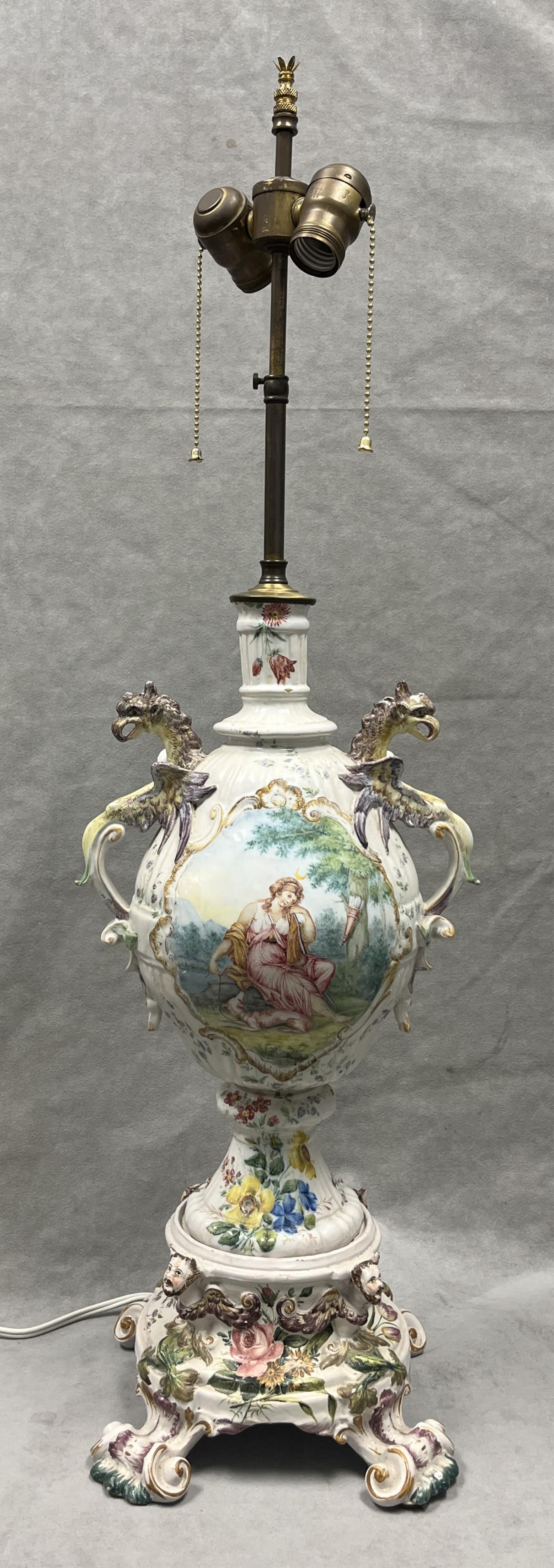 CONTINENTAL POLYCHROMED PAINTED CERAMIC TWO-LIGHT TABLE LAMP WITH GRIFFIN FORM HANDLES - H: 33 3/4, (1 of 17)