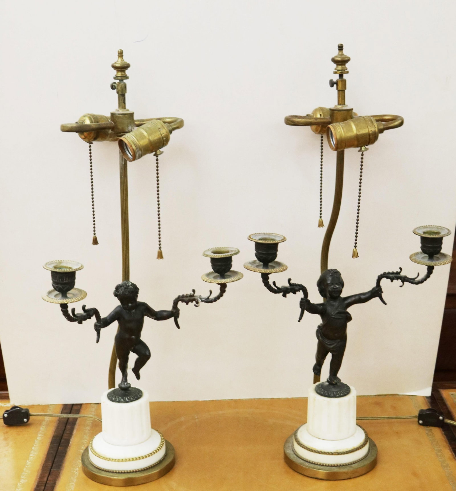 PAIR NEOCLASSICAL CAST METAL PUTTI-FORM TWO-LIGHT CANDELABRA, LATER MOUNTED AS TWO-LIGHT TABLE LAMPS (1 of 8)
