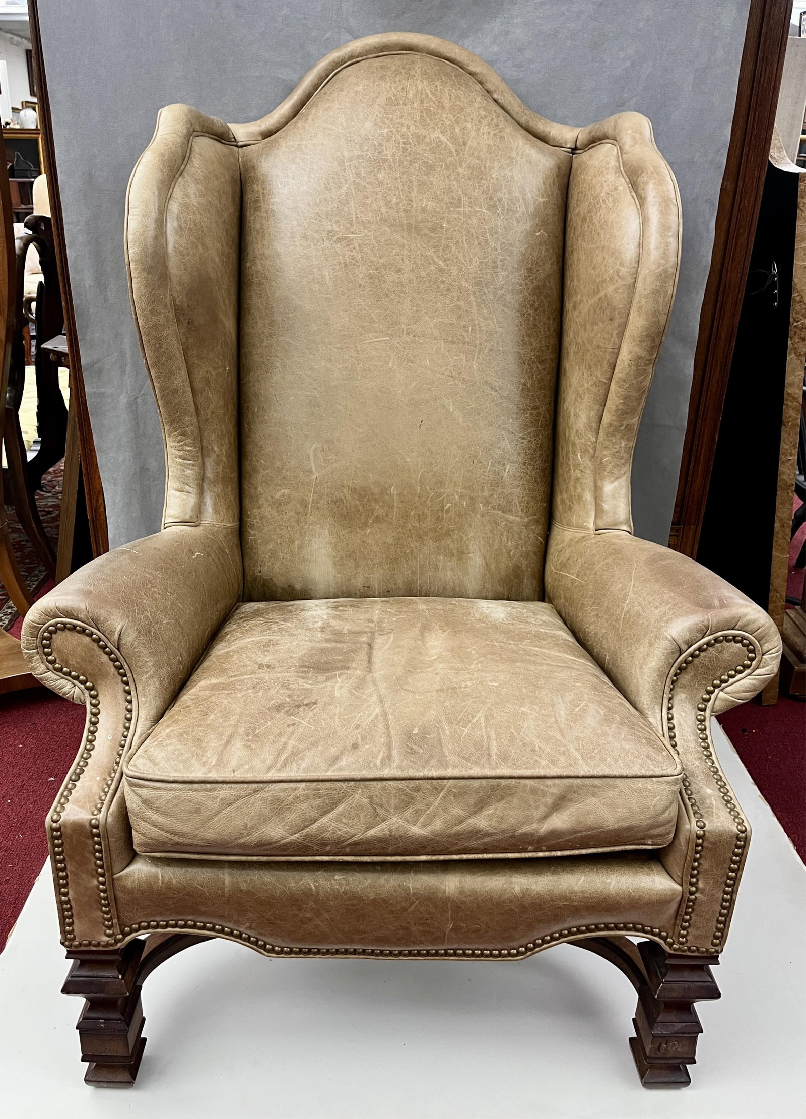 WILLIAM & MARY STYLE TAN LEATHER UPHOLSTERED WING CHAIR - H: 53 IN; W: 37 IN; D: 34 IN. (1 of 6)