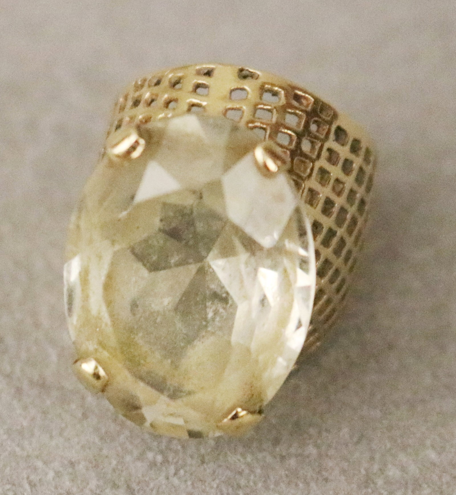 14K YELLOW GOLD AND PALE LEMON COLOR CITRINE RING Oval citrine weighing app. 10-12 ct., raised by (1 of 5)