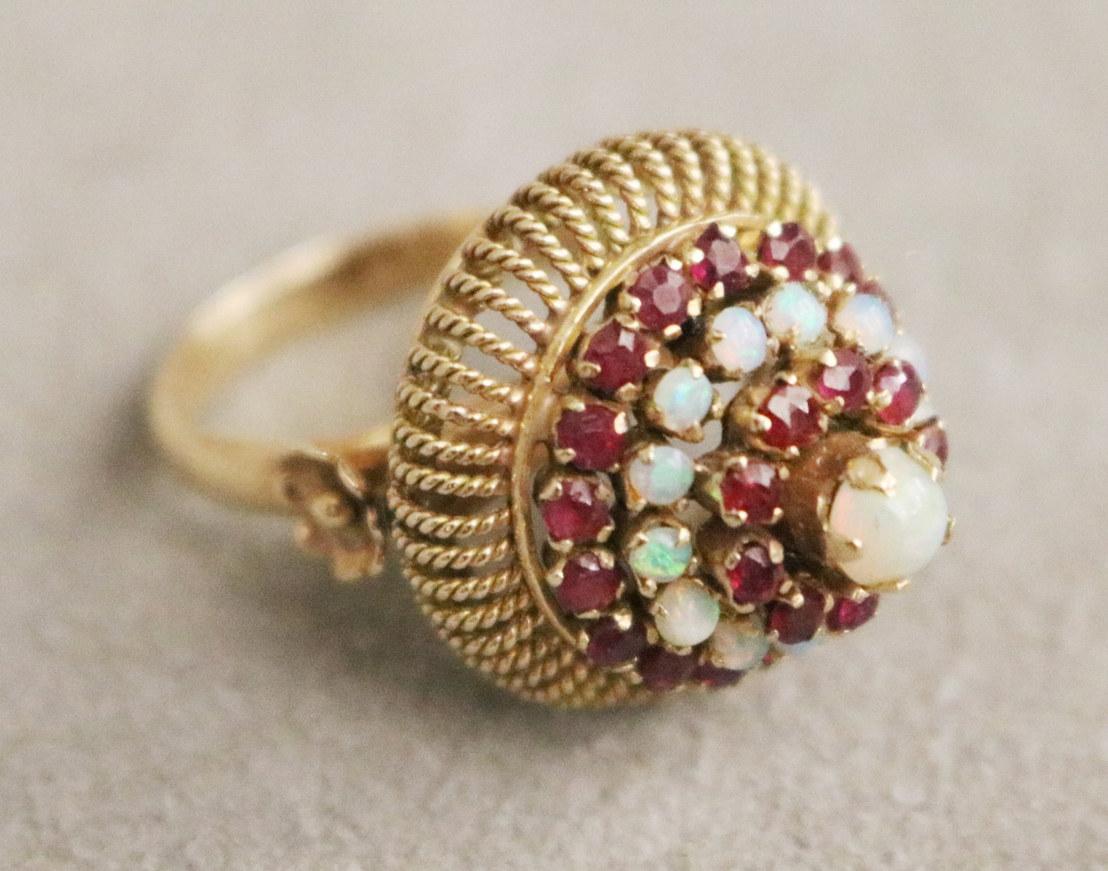 14K YELLOW GOLD, RUBY AND PRECIOUS WHITE OPAL PRINCESS STYLE DOME RING Circular openwork wire (1 of 3)