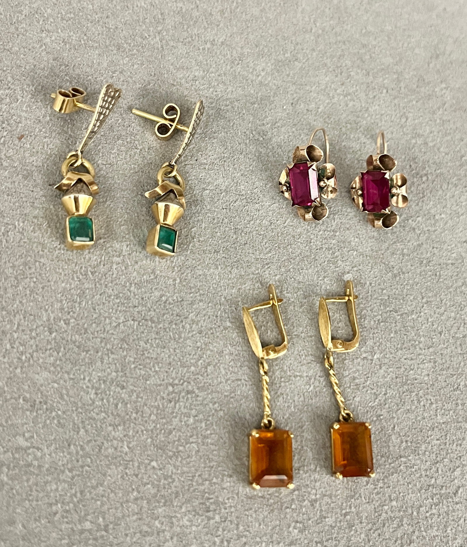THREE PAIRS GOLD AND COLORED GEMSTONE DANGLE EARRINGS One pair, 18K (750) yellow gold with (1 of 2)