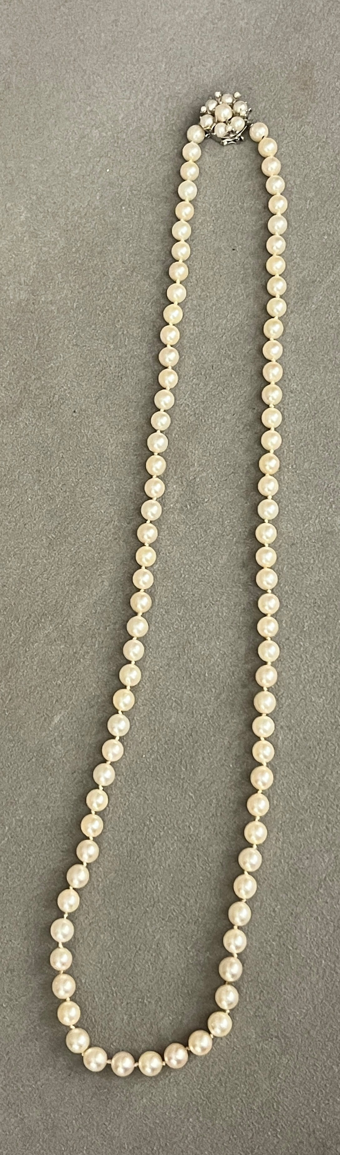 MATCHED CULTURED PEARL NECKLACE WITH 14K WHITE GOLD AND PEARL CLASP 7mm pearls; flowerhead design (1 of 4)