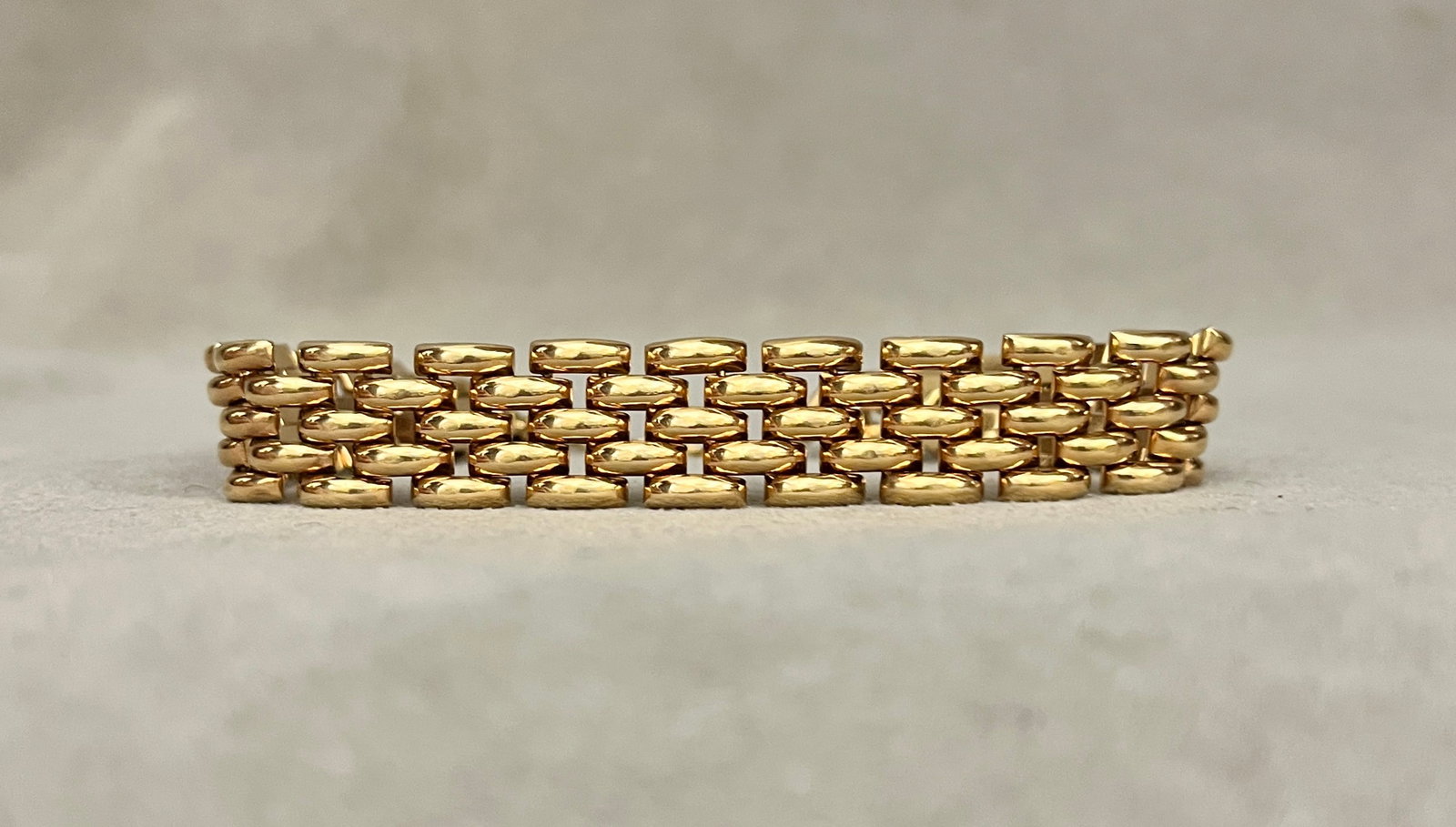 18K (750) BRIGHT-POLISHED YELLOW GOLD FLEXIBLE LINK, OPENWORK STRAP BRACELET Four rows of arched (1 of 2)