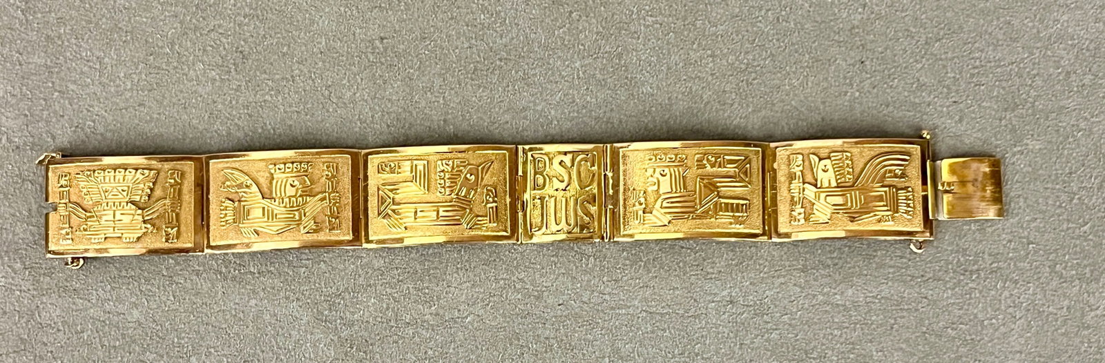 18K PERUVIAN YELLOW GOLD RECTANGULAR PANEL-LINK BRACELET Six panels, most with raised Aztec god (1 of 2)