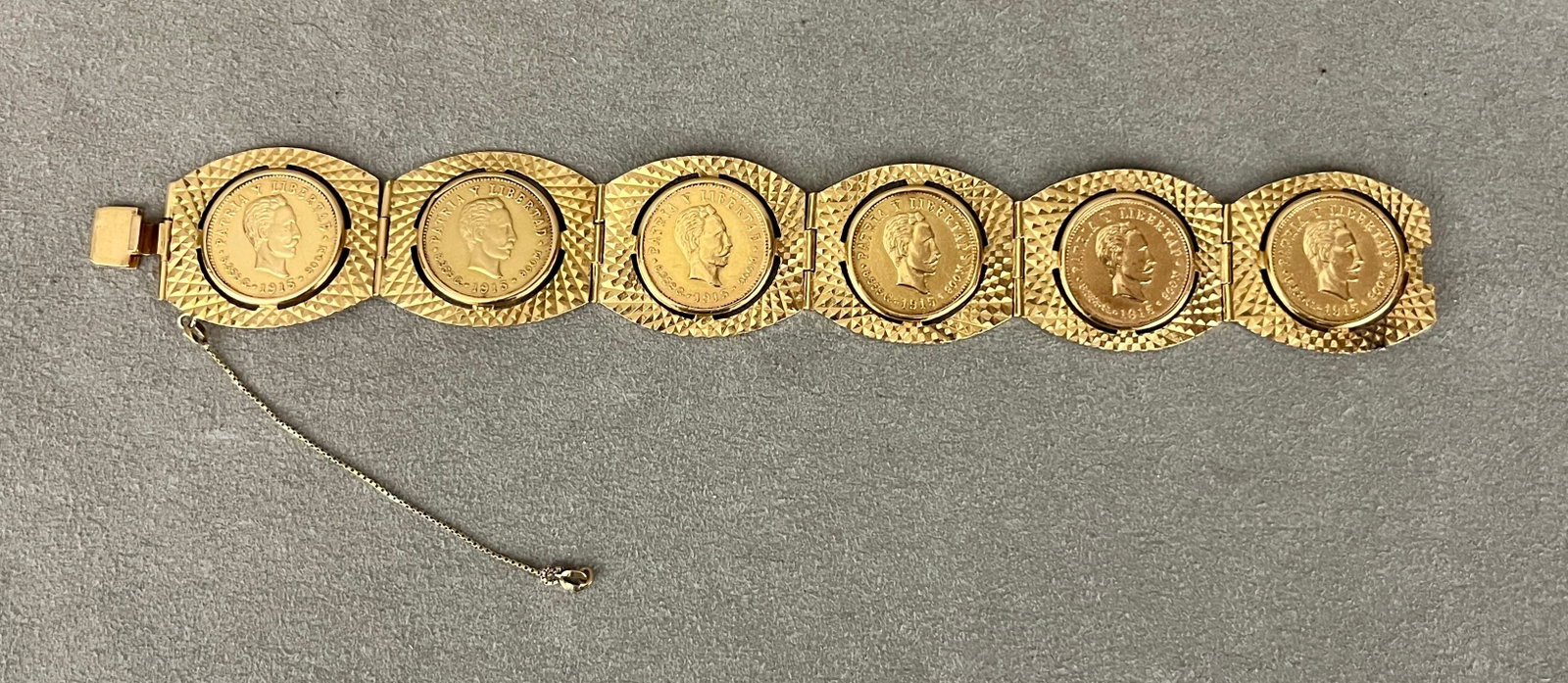 18K (750) YELLOW GOLD PANEL-LINK COIN BRACELET Six hinged barrel-shape textured gold panels each (1 of 5)