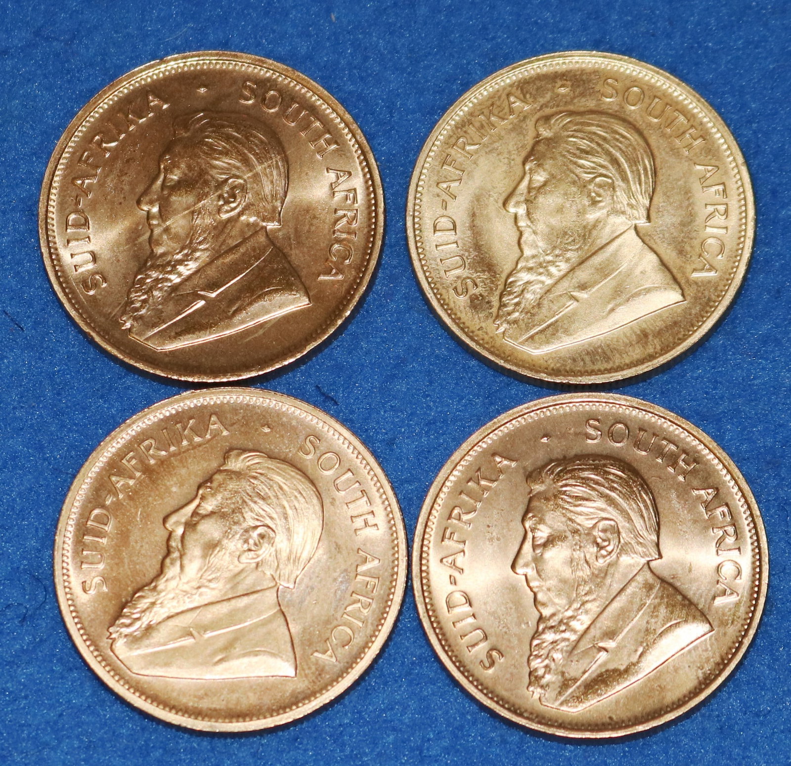 FOUR SOUTH AFRICAN GOLD KRUGERRANDS Dated 1975 (2), 1977, and 1978 (1 of 2)