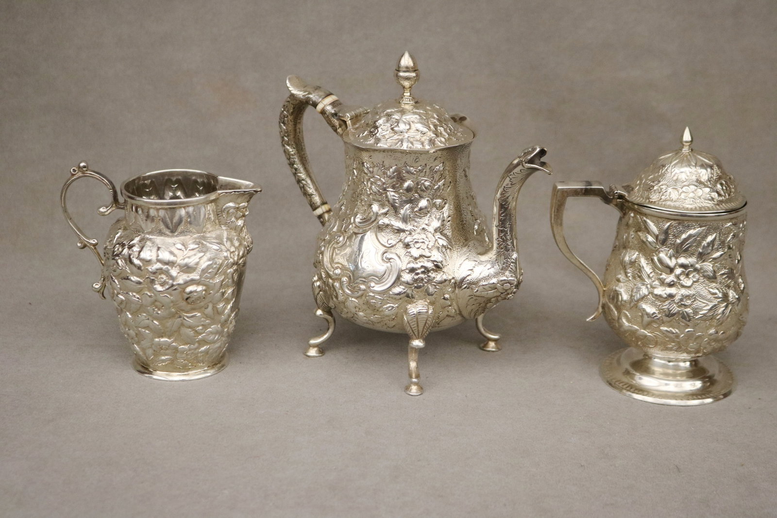 THREE STERLING SILVER FLORAL REPOUSSE TABLE ARTICLES 19th century - . (1 of 4)