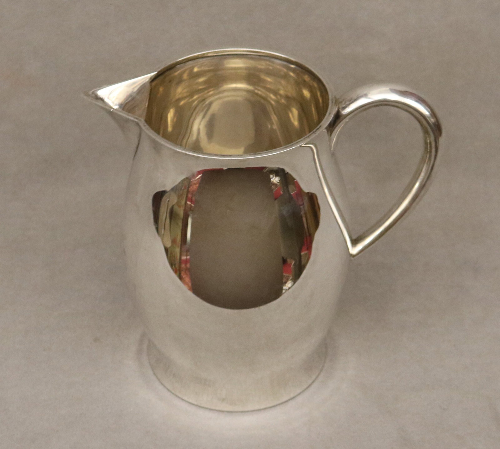 TUTTLE CO. REVERE-STYLE STERLING SILVER WATER PITCHER - H: 8 in. Wt. 24 troy oz..: TUTTLE CO. REVERE-STYLE STERLING SILVER WATER PITCHER 4 1/4 pints Engraved under foot. H: 8 in. Wt. 24 troy oz.