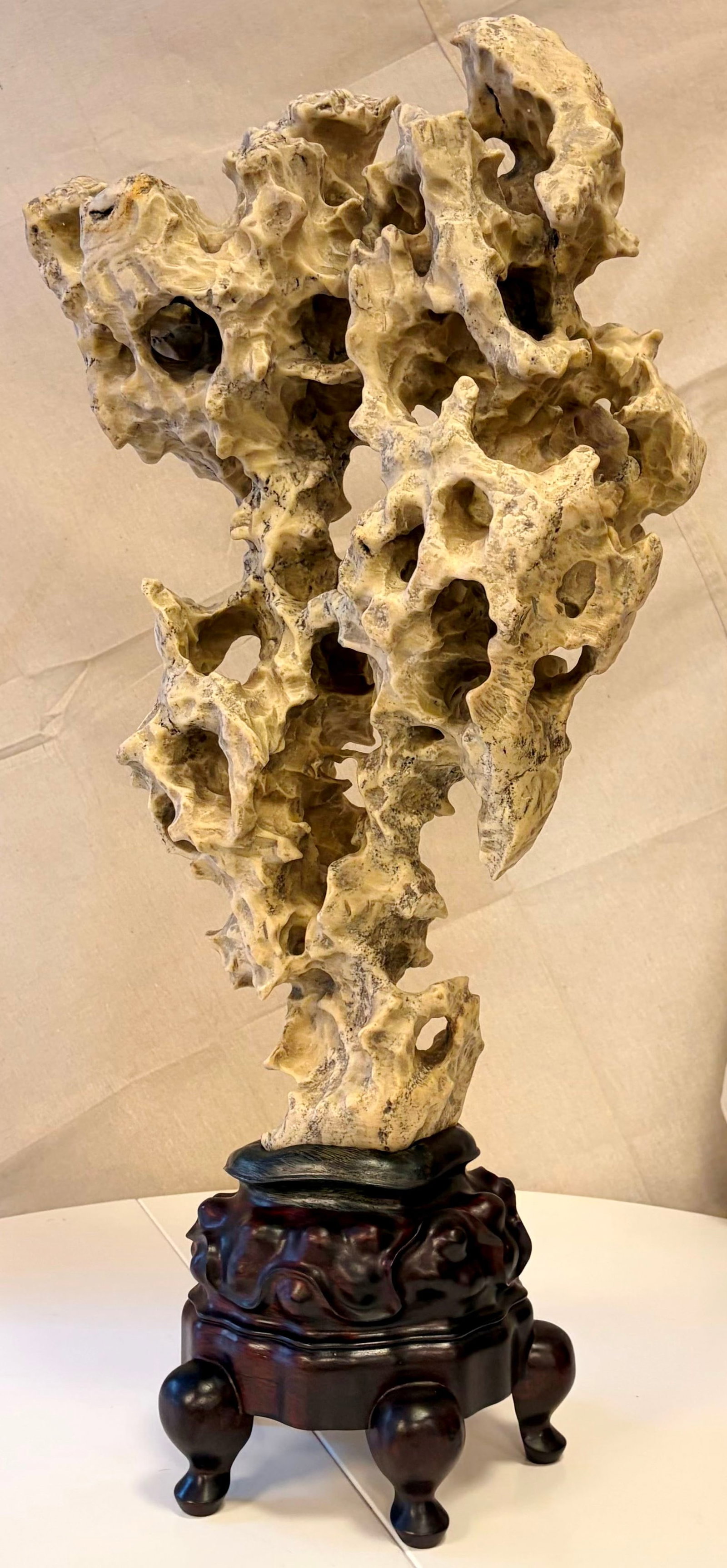 CHINESE TAIHU SCHOLAR STONE MOUNTED ON CARVED DARK WOOD STAND - H: 30 1/2 in., overall with stand.. (1 of 1)