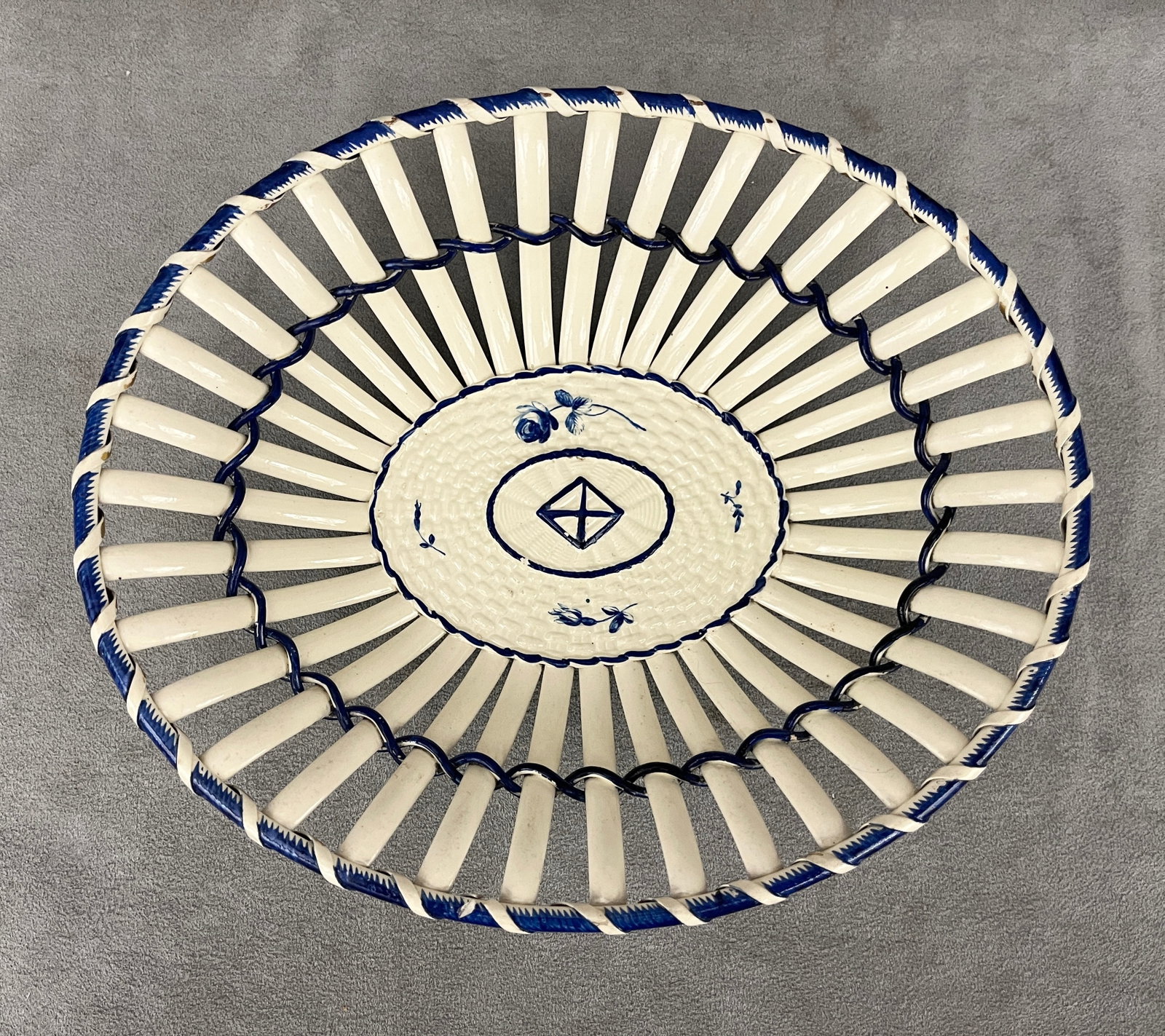 ENGLISH CREAM-WARE OPENWORK OVAL DISH WITH COBALT BLUE ACCENTS - 9 1/2 in. x 8 in..: ENGLISH CREAM-WARE OPENWORK OVAL DISH WITH COBALT BLUE ACCENTS Impressed "Neale & Co." underfoot 9 1/2 in. x 8 in.